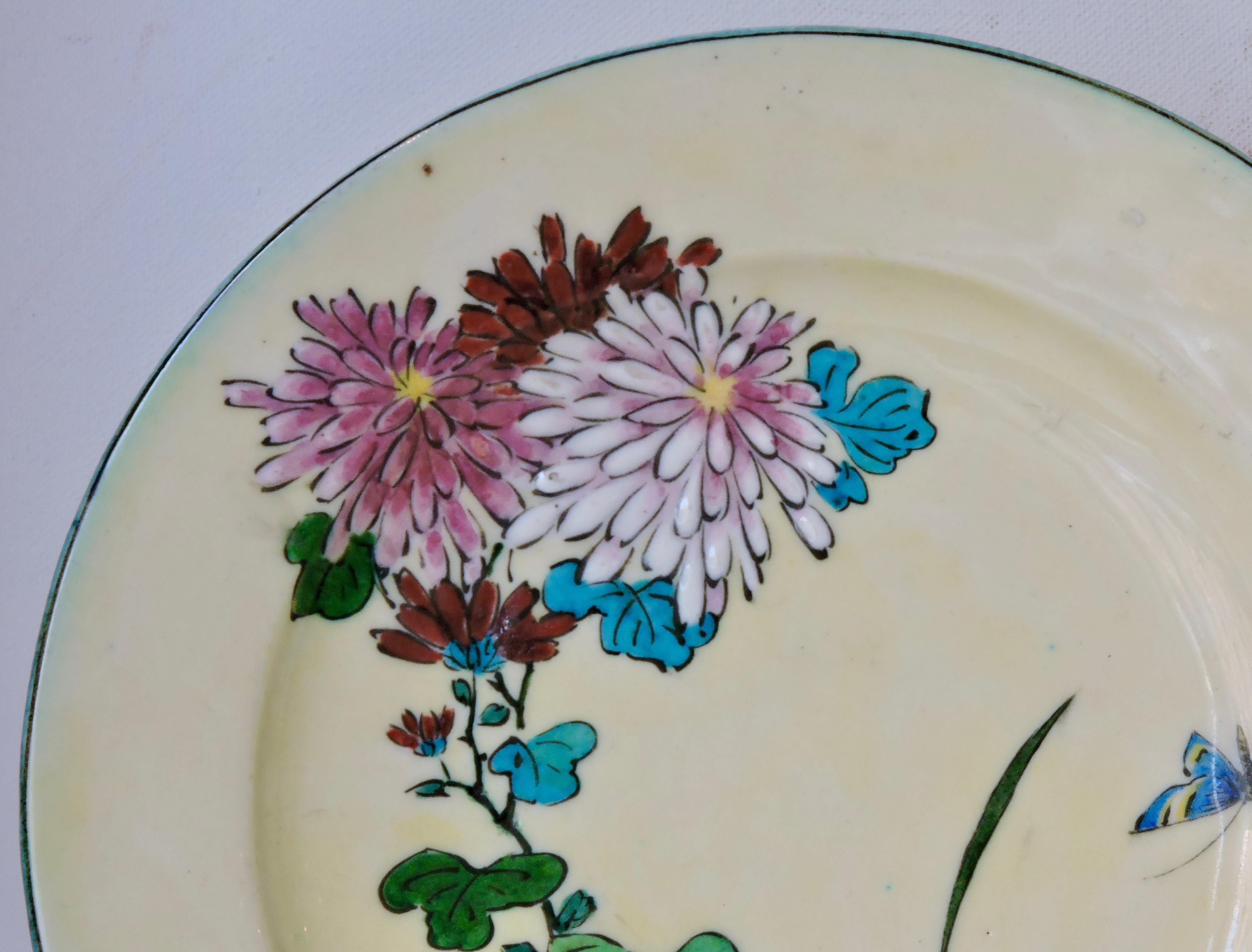 A Théodore Deck circular enamelled faience platter with polychrome design of flowers and butterflies on a cream background.
Signed with TH. Deck stamp on the reverse
circa 1870.