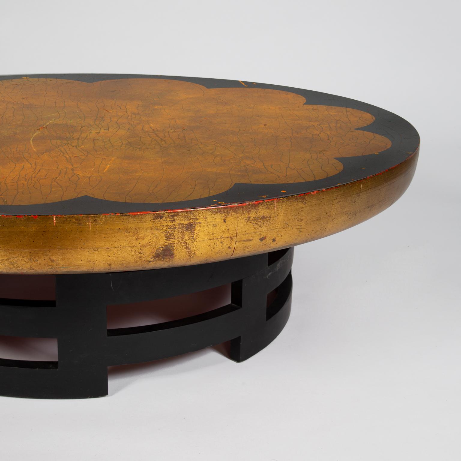 Low circular coffee table with a 'lotus' style patterned top, designed by Theodore Muller and Isabel Barringer for Kittinger.
Style of James Mont with gilt, layered lacquers and craquelure effect.