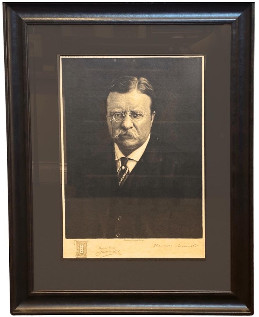 Presented is a handsome etched portrait of President Theodore Roosevelt by 20th century artist Jacques Reich. The etching, printed in 1919, is signed by the artist in pencil and noted as a remarque proof. Reich etched a remarque of a blue star flag