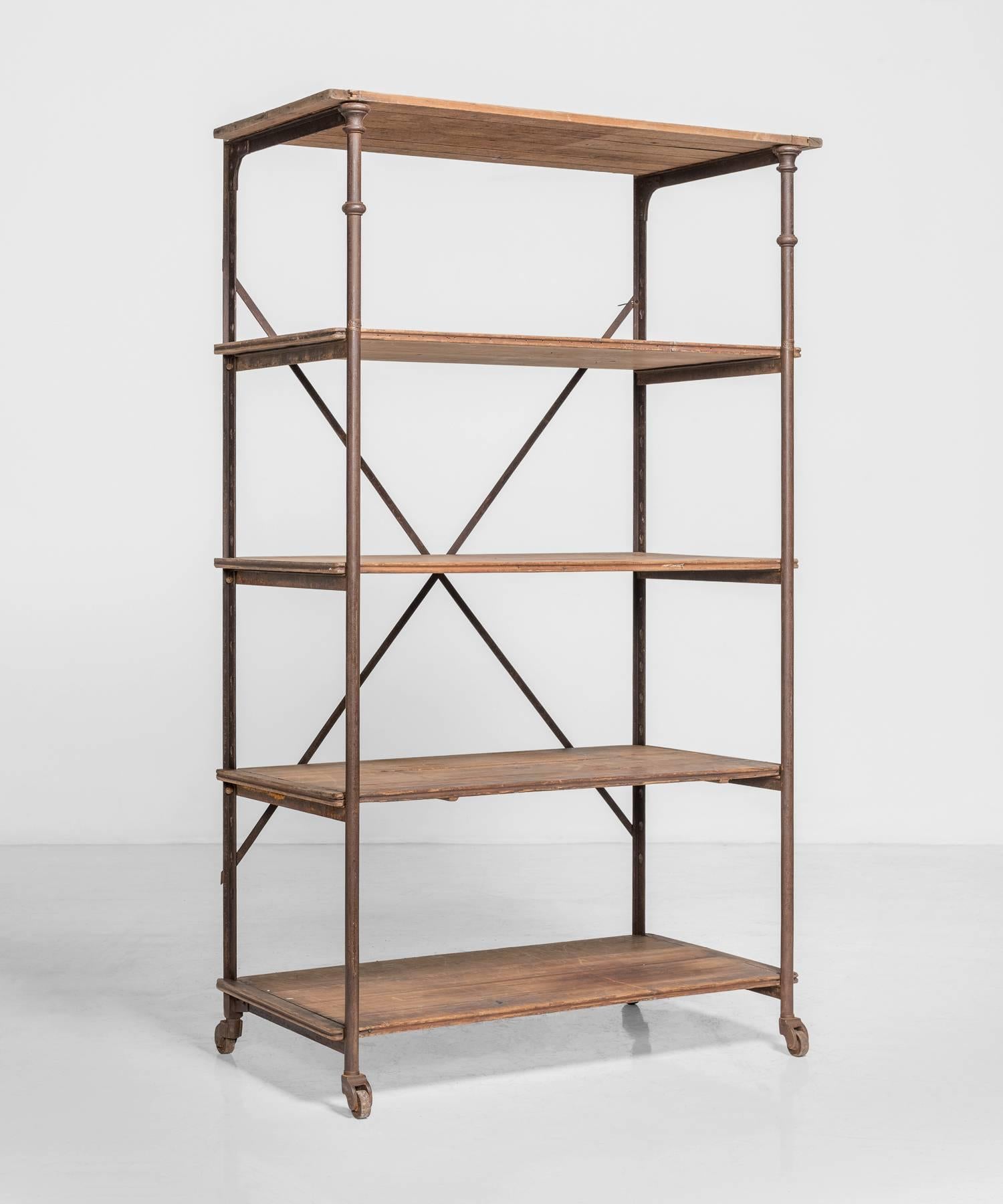 Painted iron frame with oak shelves. Manufactured by TH Scherf, 49 Rue Lauriston, Paris.