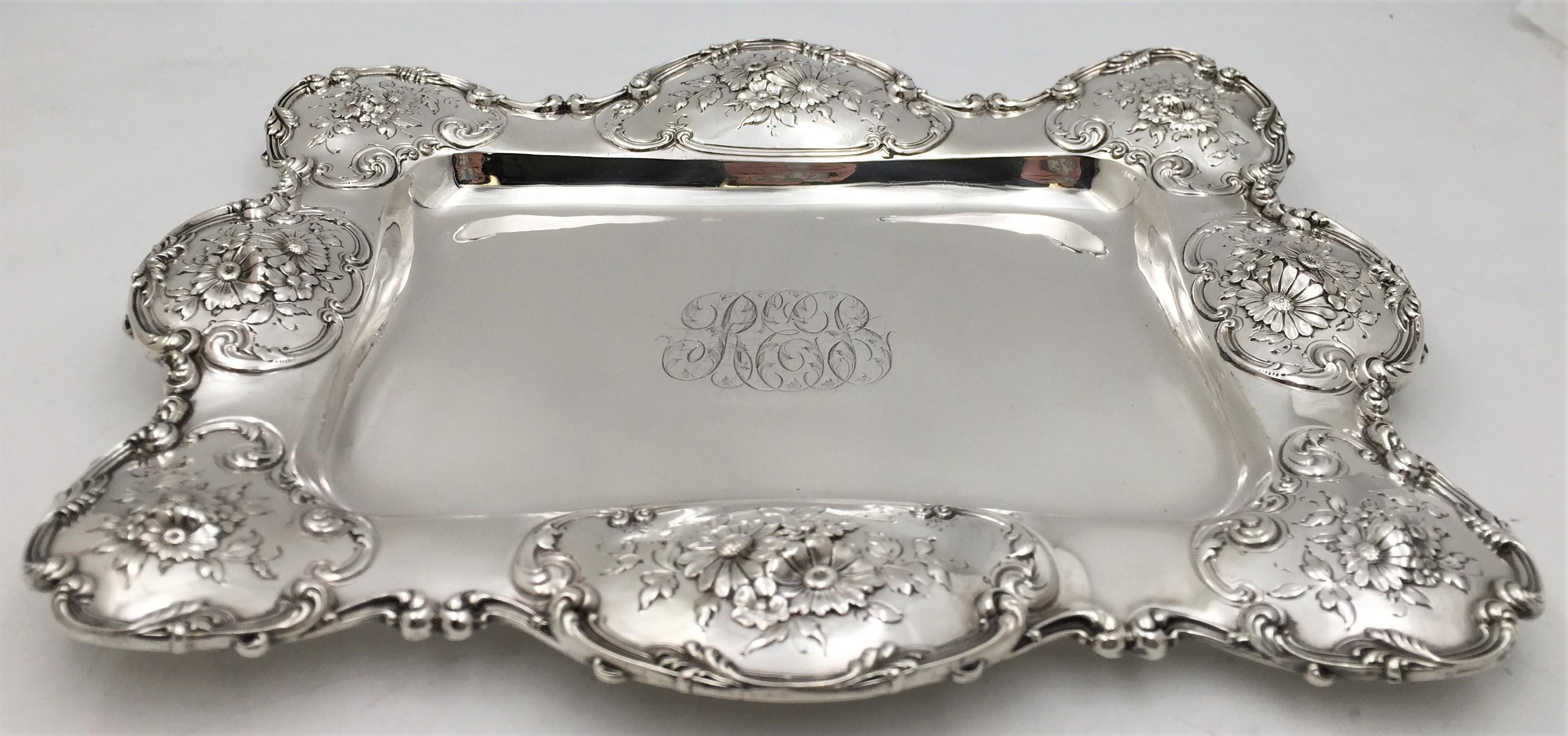 Theodore B. Starr sterling silver asparagus serving dish or platter in Art Nouveau style with raised floral motifs in cartouches. It measures 14 1/2'' in length by 11 3/4'' in width by 1 1/3'' in height, weighs 30.6 troy ounces, and bears hallmarks
