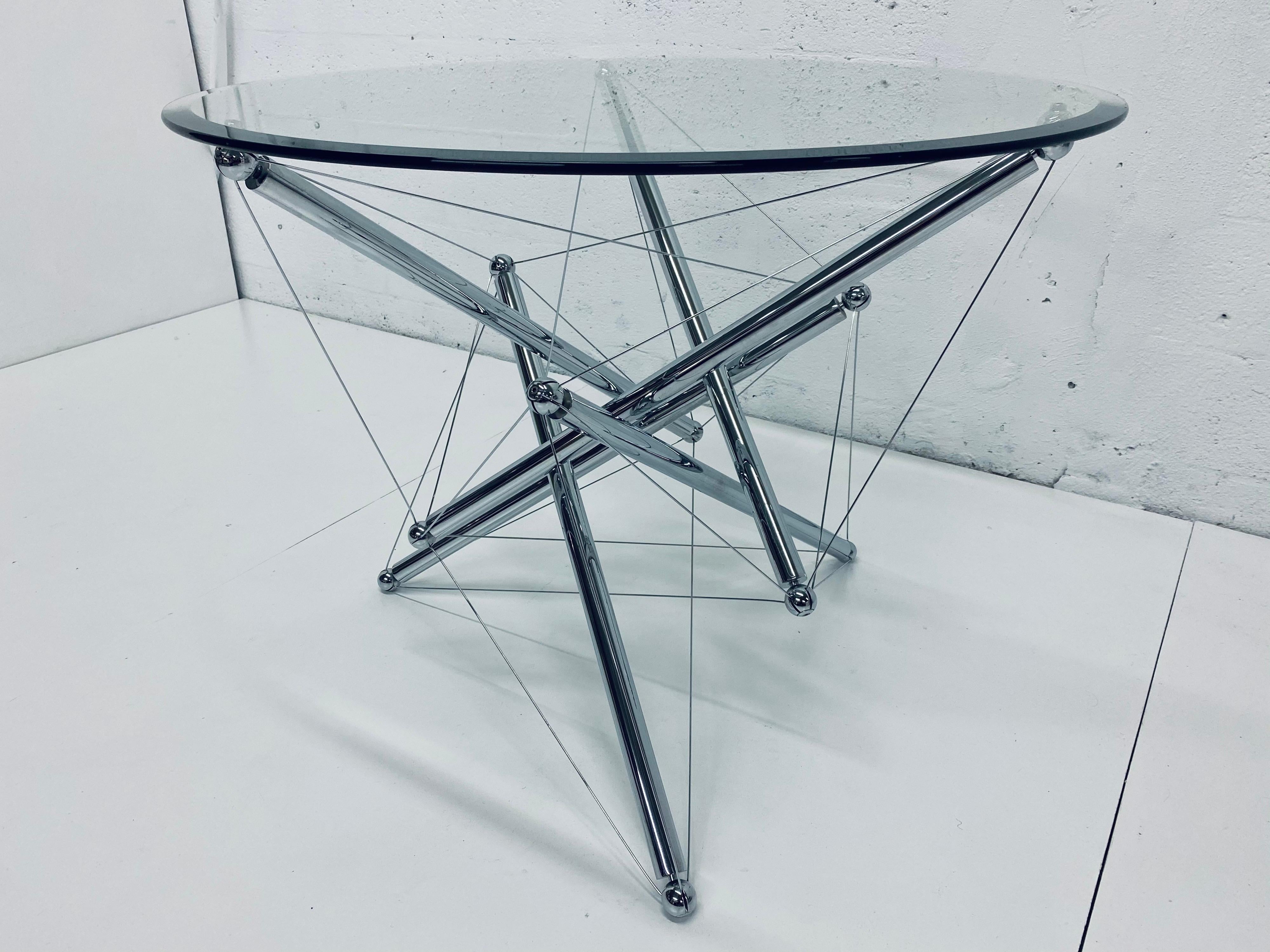 Theodore Waddell designed tensegrity table made of chrome-plated steel tubing and steel tension wires with one inch beveled glass top. Easily replace glass with up to 53 inches as recommended by Cassina.