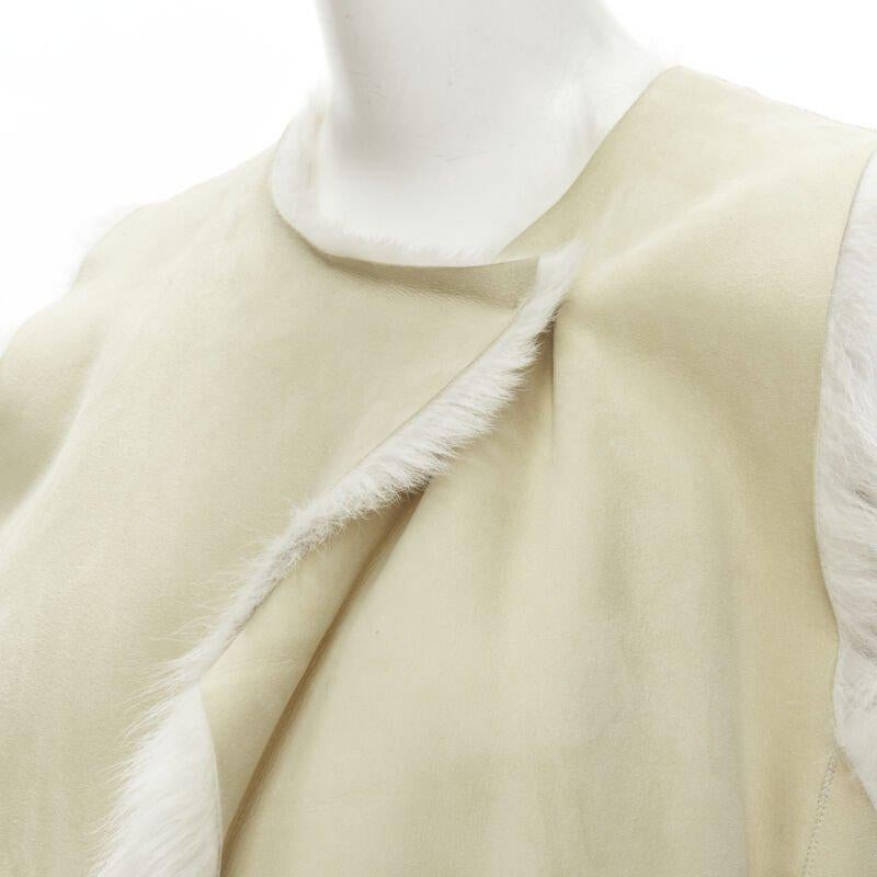 THEORY beige shearling lamb fur lined suede vest XS
Reference: KNLM/A00051
Brand: Theory
Material: Shearling
Color: Beige
Pattern: Solid
Lining:  Fur
Extra Details: Single hook eye wrap front. Double front pockets.
Made in: