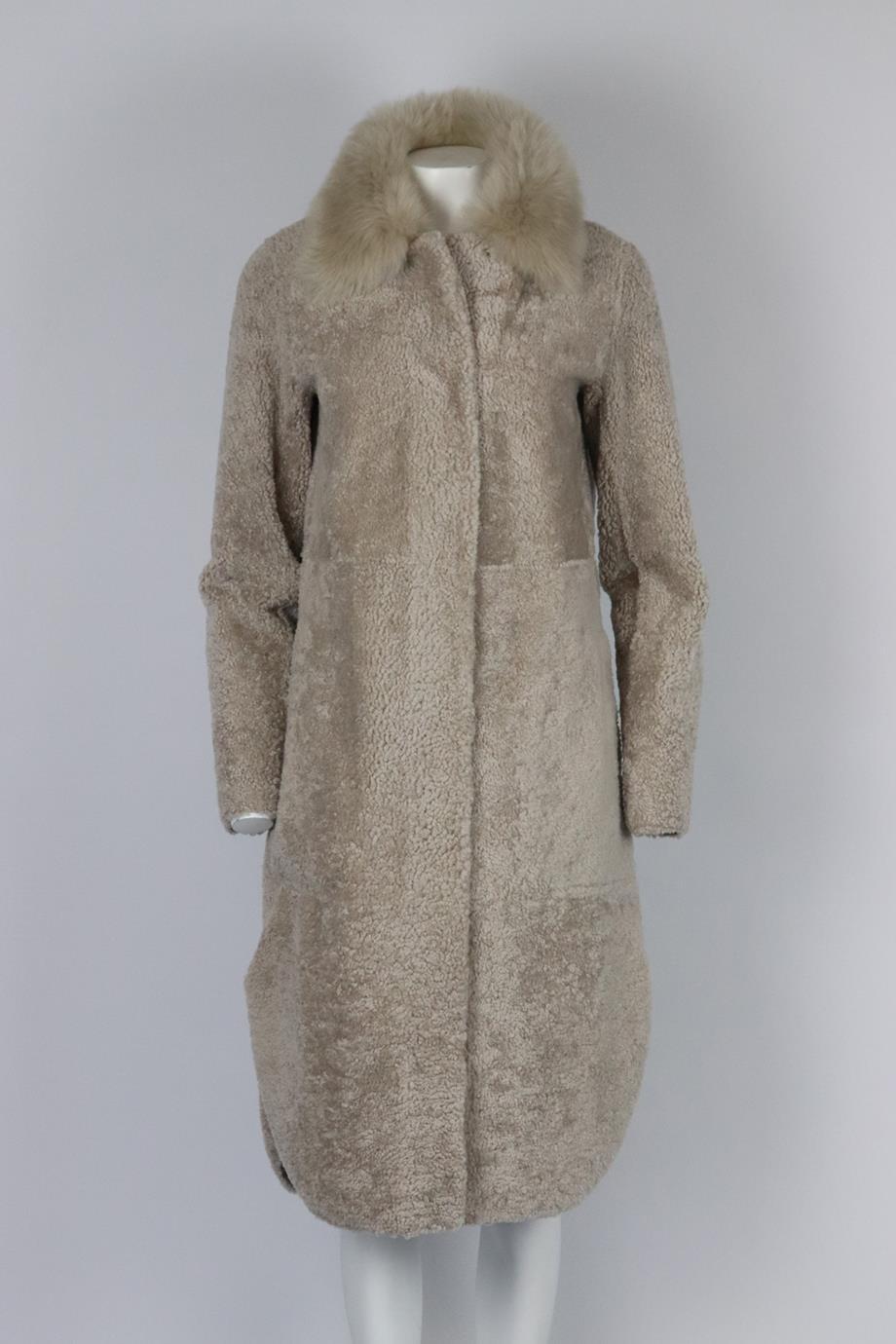 Theory belted shearling coat. Grey. Long sleeve, crewneck. Snap button and belt fastening at front. 100% Leather; fabric2: 100% lamb. Size: XSmall (UK 6, US 2, FR 34, IT 38). Shoulder to shoulder: 17 in. Bust: 40 in. Waist: 41 in. Hips: 46 in.