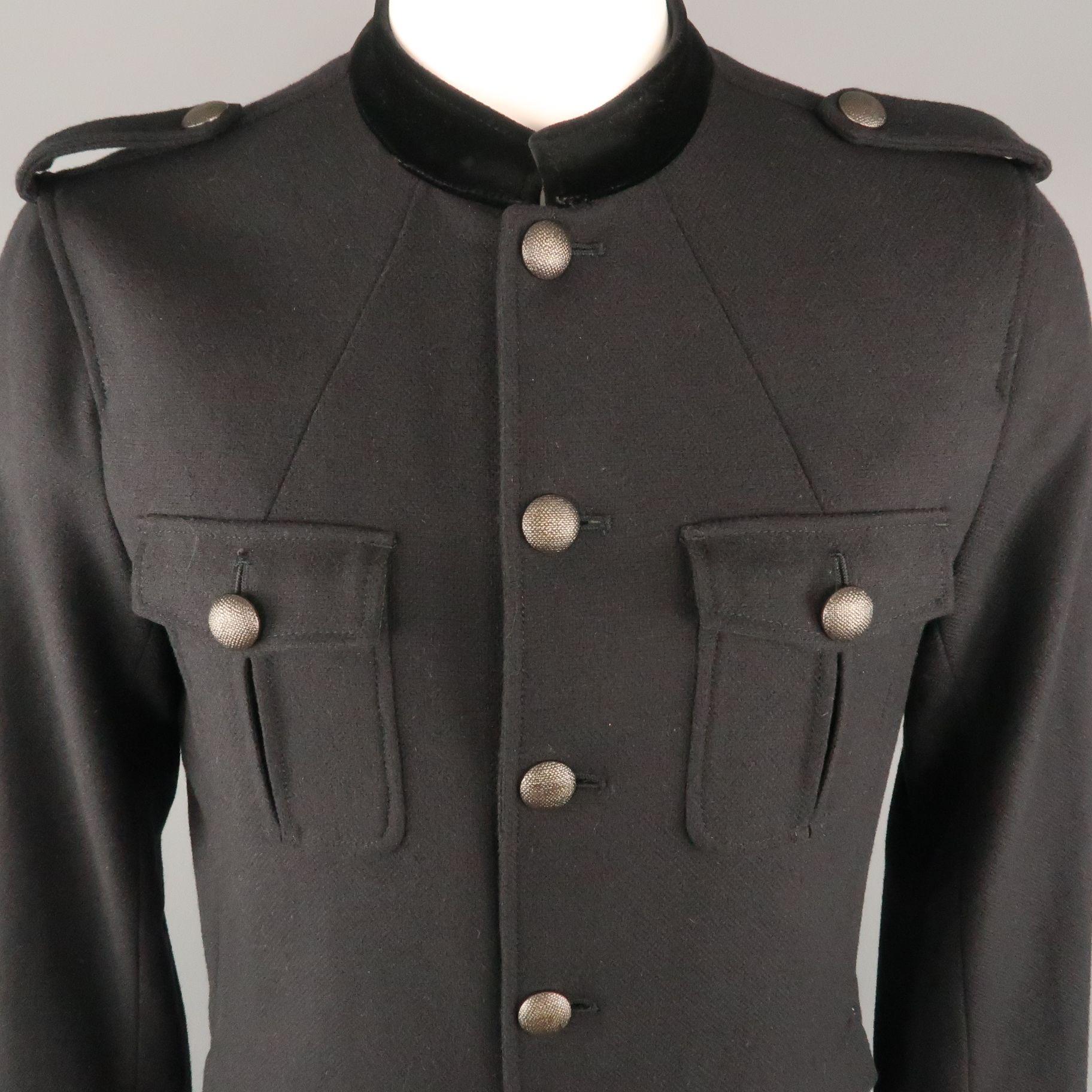 THEORY Military Style Jacket comes in a black tone in a solid wool / camel material, with epaulettes, a velvet collar, patch and flap pockets, unbuttoned cuffs and a single vent at back.
 
Excellent Pre-Owned Condition.
Marked: L
 
Measurements:
