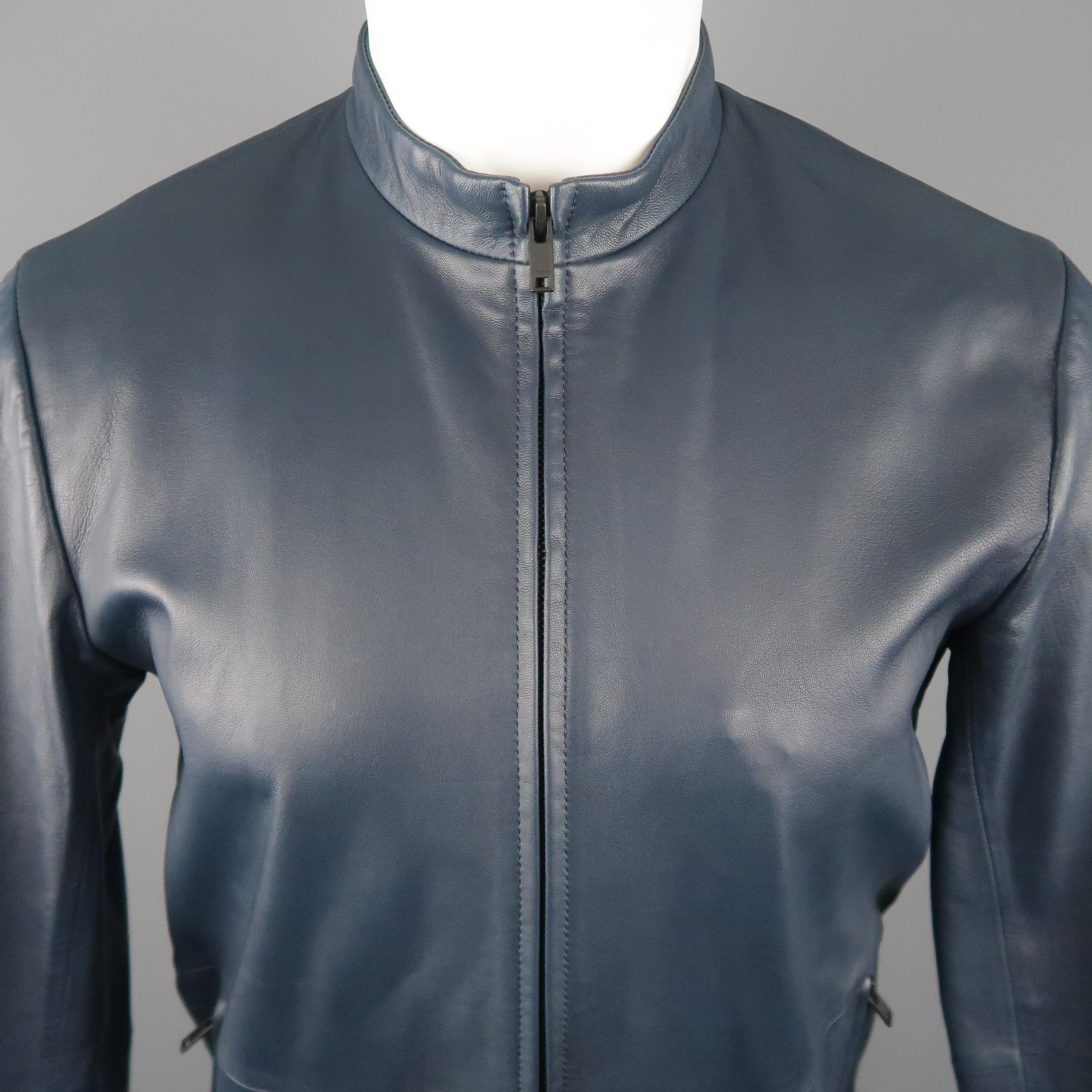 THEORY Jacket comes in a navy tone in a solid leather material, with zip pockets, zip up.
 
Excellent  Pre-Owned Condition.
Marked: S
 
Measurements:
 
Shoulder: 17 in.
Chest: 40 in.
Sleeve: 26 in.
Length: 25 in.