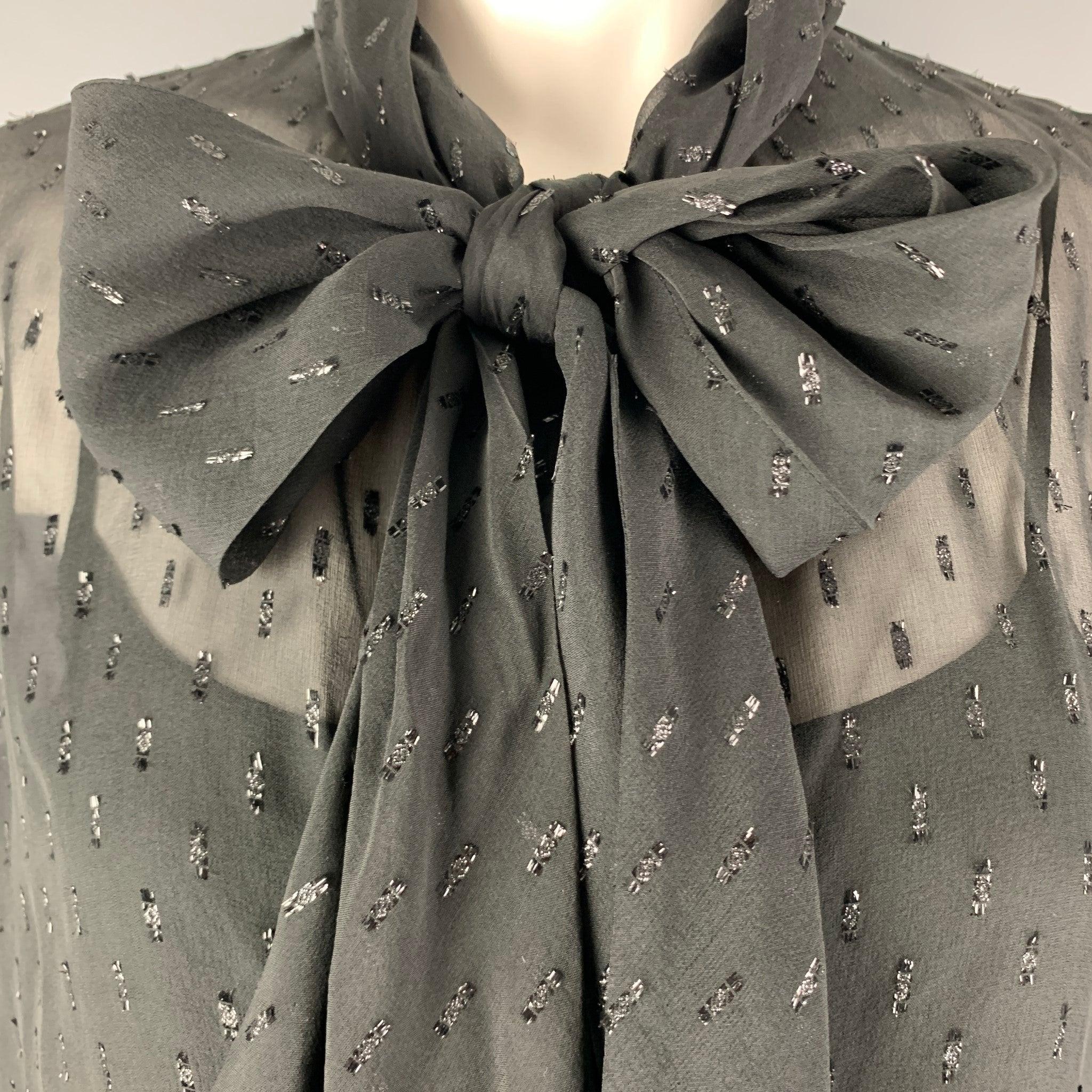 THEORY shift dress comes in a black woven material featuring a novelty shiny texture, and bow tie around neck.
Including slip dress as lining.Excellent Pre-Owned Condition. 

Marked:  2 

Measurements: 
 
Shoulder: 16 inches Sleeves: 24 inches Bust: