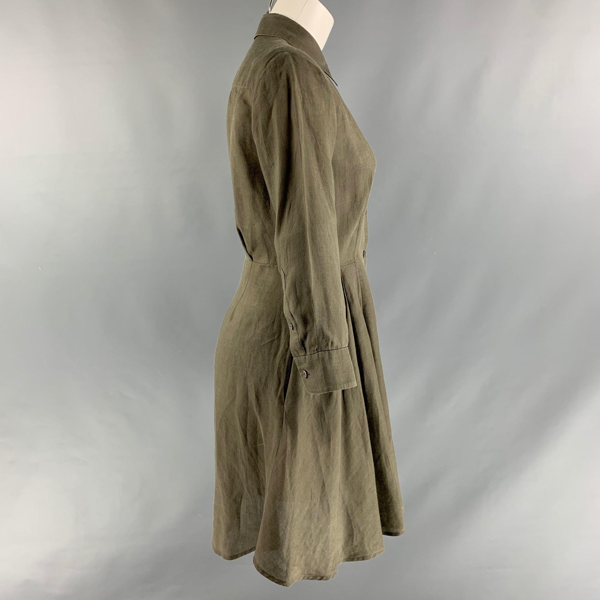 THEORY shirt dress comes in a olive ramie fabric featuring long sleeves, a patch pocket, spread collar, and a buttoned closure. Very Good Pre-Owned Condition. 

Marked:   2 

Measurements: 
 
Shoulder: 14.5 inches Bust: 38 inches Sleeve: 19.5 inches