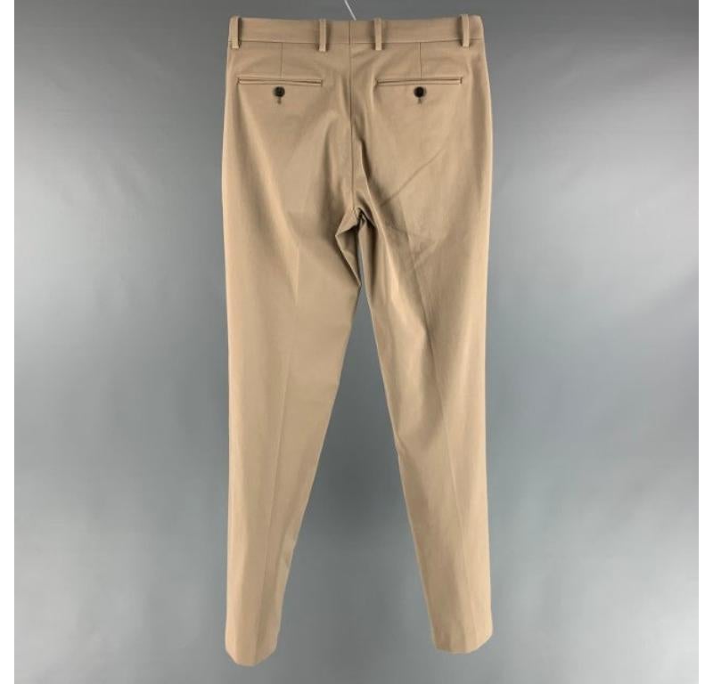 THEORY casual pants comes in a khaki cotton twill featuring a flat front and a zip fly closure. New with Tags. 

Marked:  30 

Measurements: 
 Waist: 30 inches Rise: 9.5 inches Inseam: 34 inches 
 
 
 
Reference: 125388
Category: Dress Pants
More