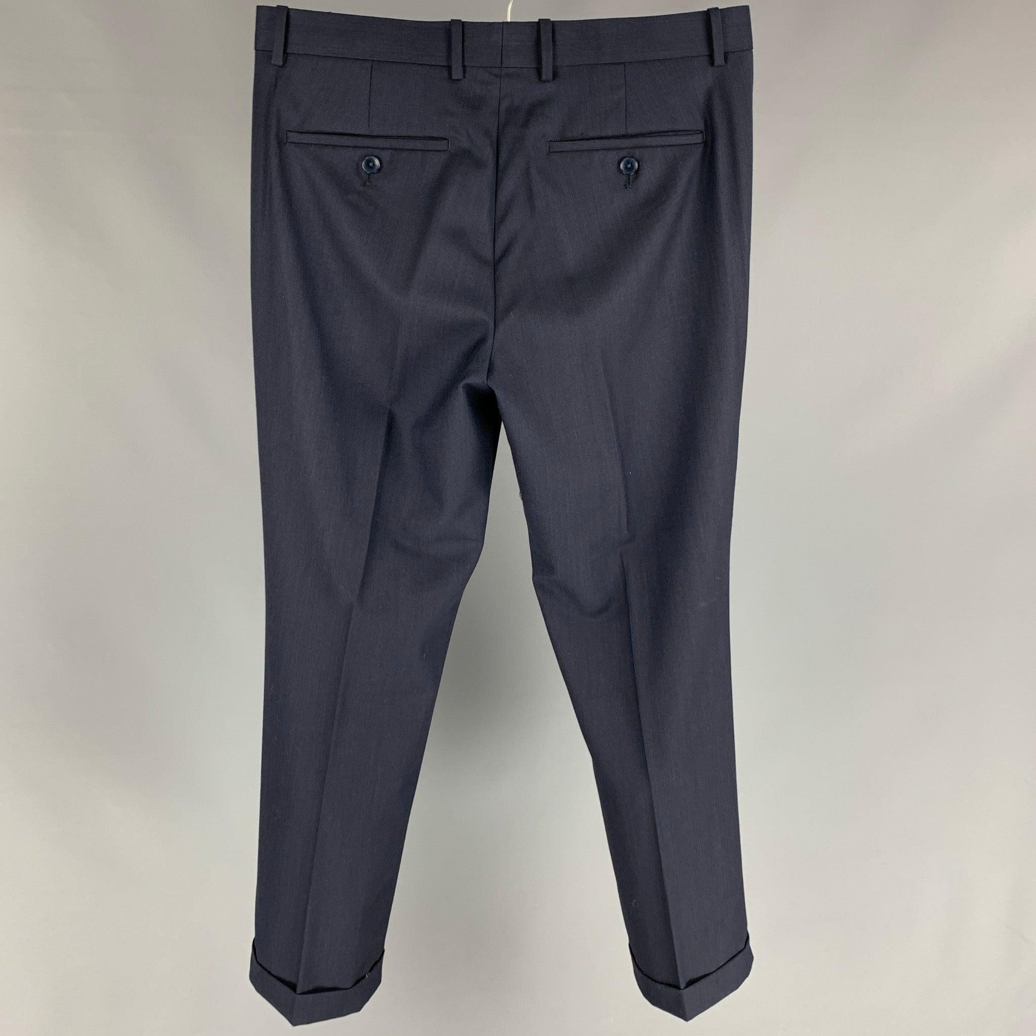 THEORY dress pants comes in a navy wool featuring flat front, cuffed legs, front tabs, and a zip fly closure.Very Good
Pre-Owned Condition. 

Marked:   31 

Measurements: 
  Waist: 31 inches  Rise: 10 inches  Inseam: 28 inches 
  
  
 
Reference:
