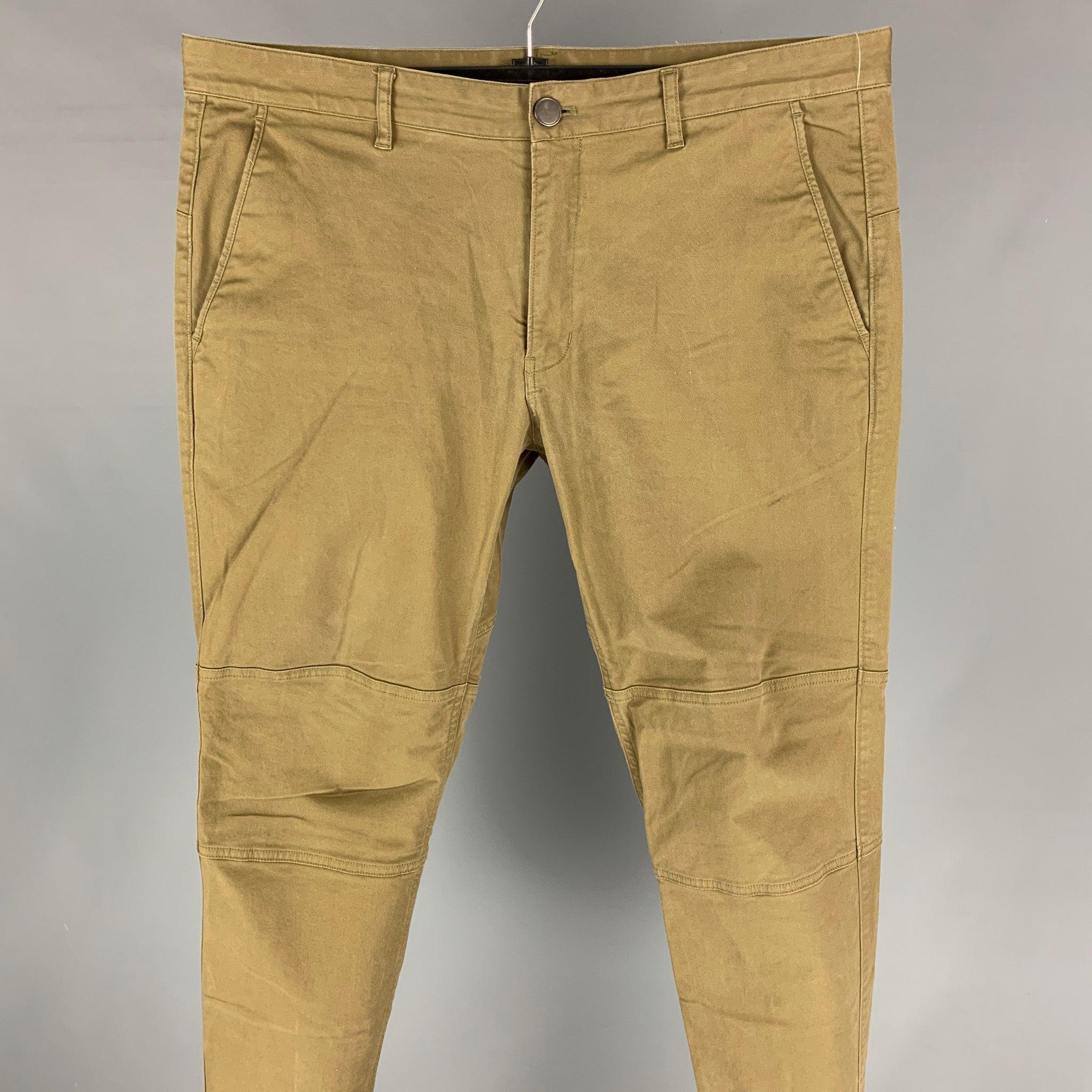 THEORY casual pants comes in a khaki cotton / polyurethane featuring a straight leg, knee panels, slim fit, and a zip fly closure.
Very Good
Pre-Owned Condition. 

Marked:   36 

Measurements: 
  Waist: 36 inches  Rise: 10.5 inches  Inseam: 30