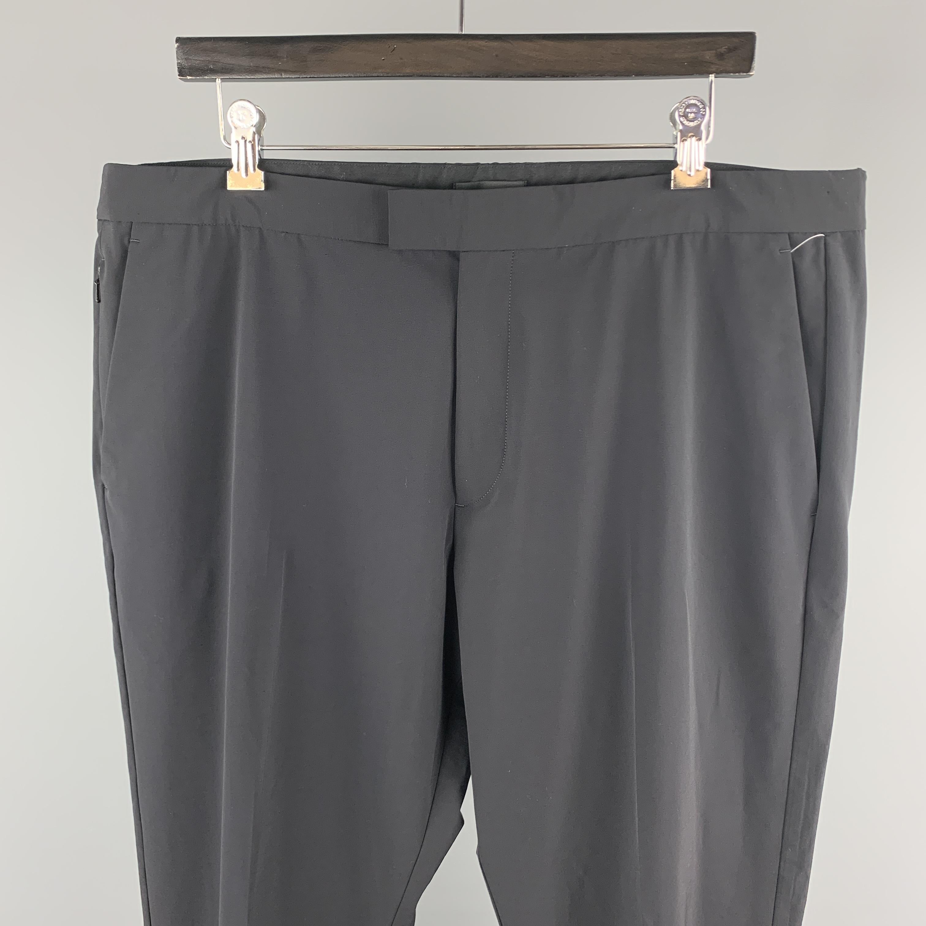 THEORY dress pants comes in a polyester blend featuring a flat front style, front tab, and a zip fly closure.  
 

Excellent Pre-Owned Condition.
Marked: 38

Measurements:

Waist: 38 in. 
Rise: 11 in.
Inseam: 31 in. 
 