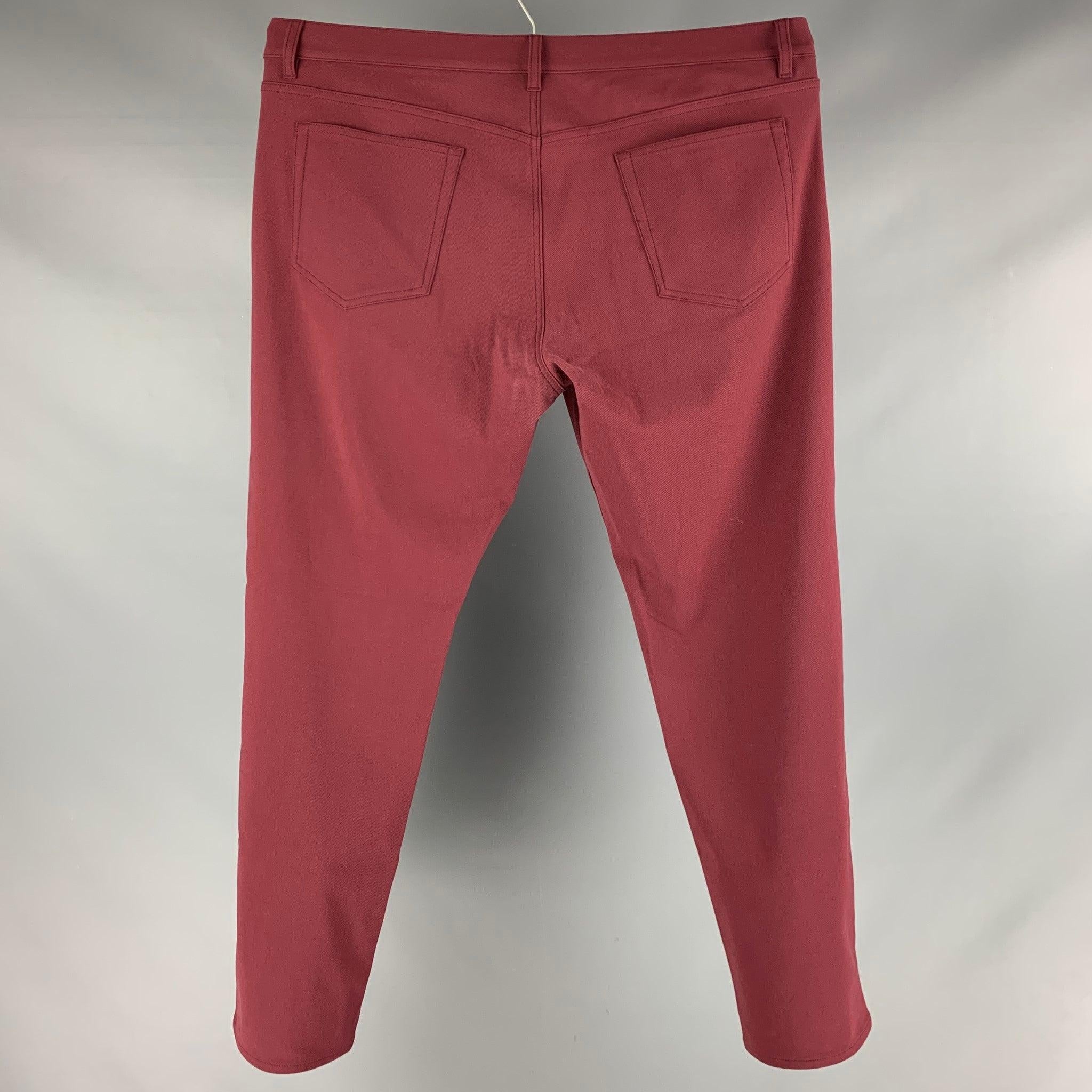 THEORY casual pants comes in a burgundy twill featuring a flat front and a zip fly closure.Excellent Pre- Owned Material. 

Marked:   40 

Measurements: 
  Waist: 43 inches Rise: 10.5 inches Inseam: 31.5 inches 
 

  
  
 
Reference: