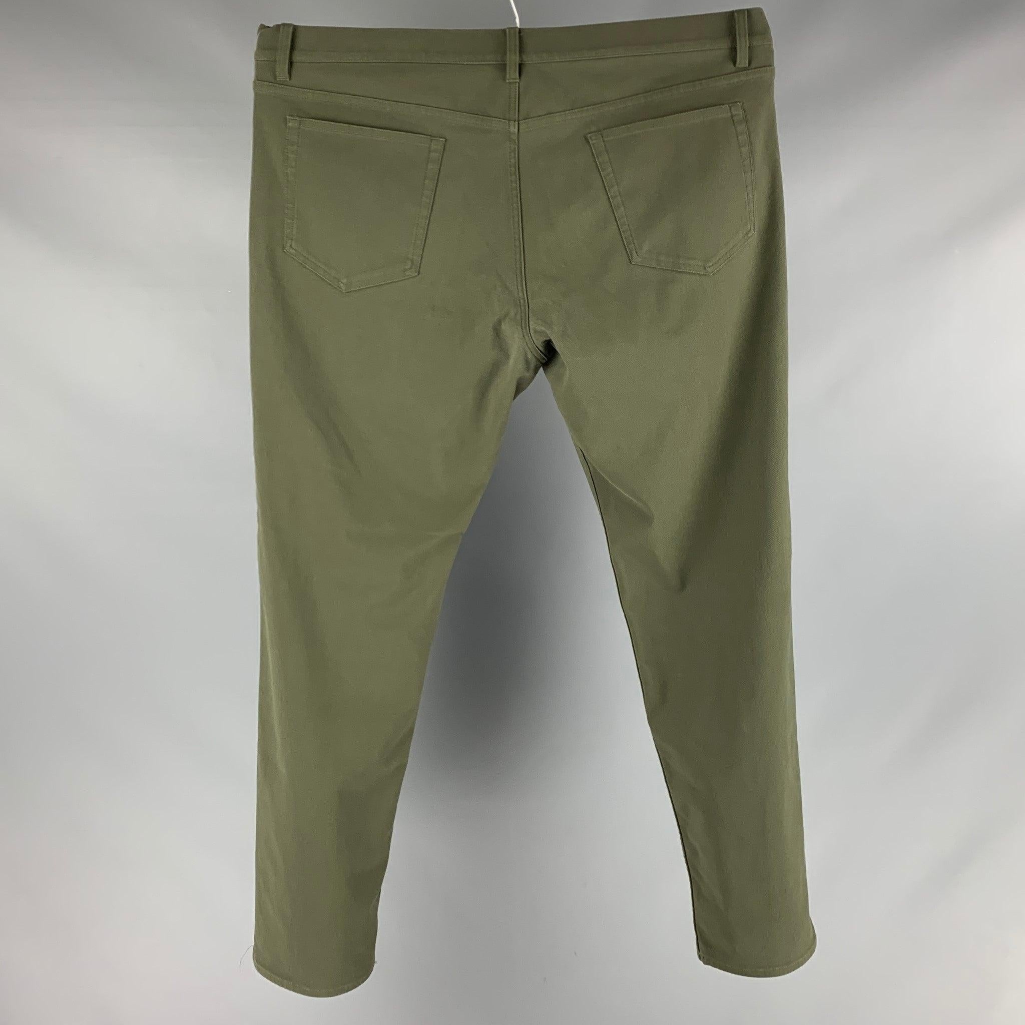 THEORY casual pants comes in a green cotton blend twill featuring a flat front and a zip fly closure.Excellent Pre- Owned Material. 

Marked:   40 

Measurements: 
  Waist: 43 inches Rise: 10.5 inches Inseam: 31.5 inches 
 
  
  
 
Reference: