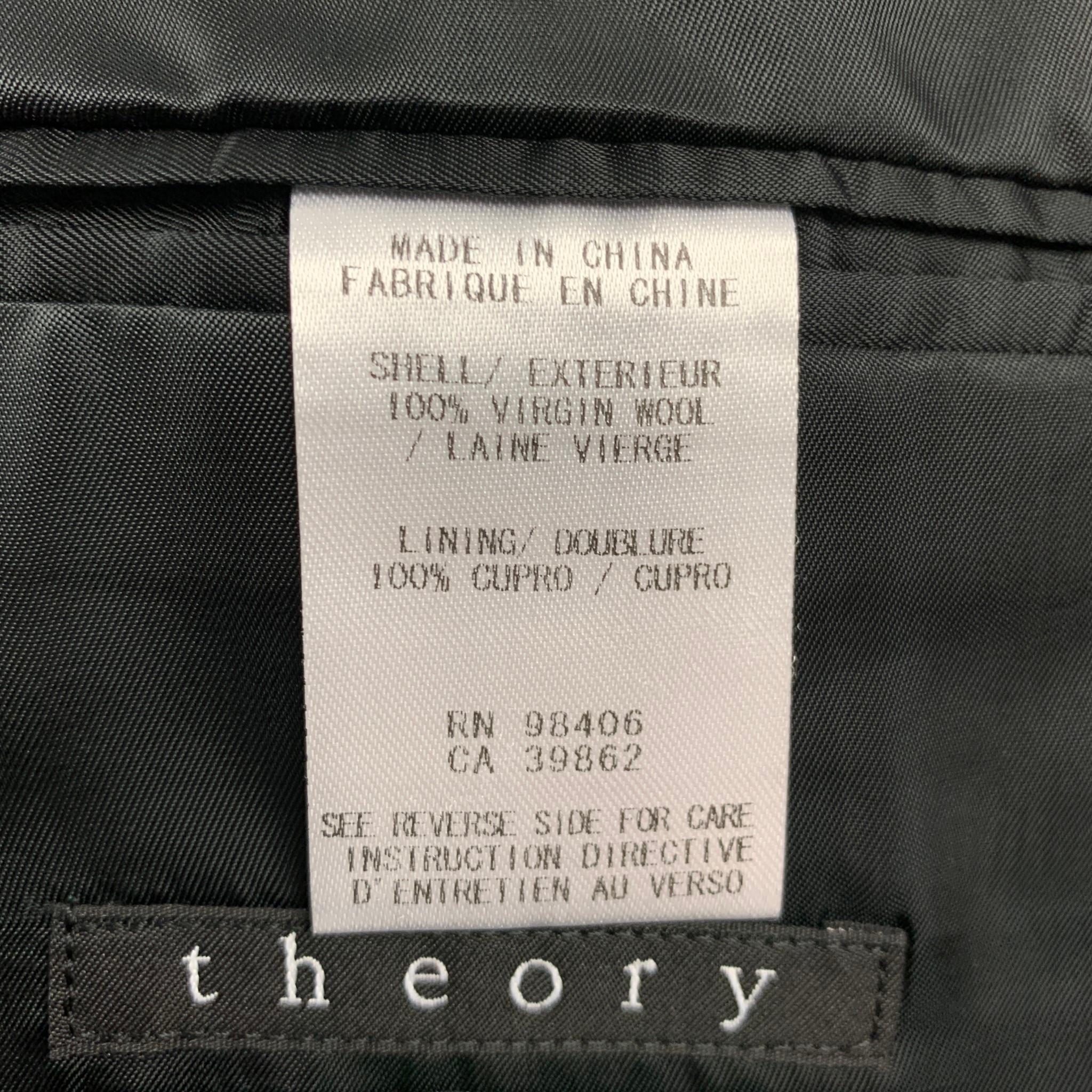 THEORY sport coat comes in a navy & black wool with a full liner featuring a notch lapel, flap pockets, and a single button closure.

Very Good Pre-Owned Condition.
Marked: 40 Regular

Measurements:

Shoulder: 18 in.
Chest: 40 in.
Sleeve: 26