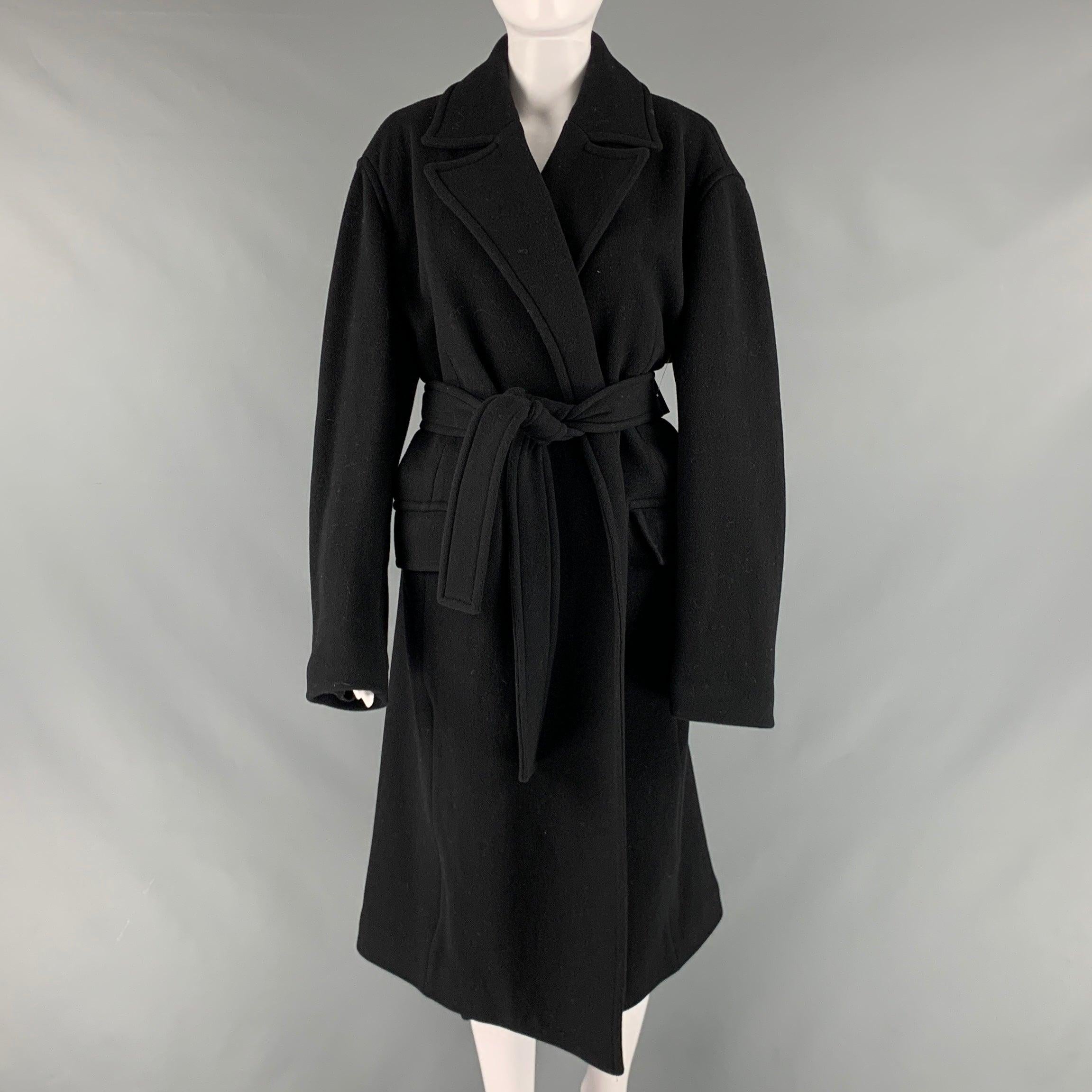 THEORY coat comes in a black wool with full lining featuring a single breasted style, notch lapel, and belt.Very Good Pre-Owned Condition. Minor marks. 

Marked:   L 

Measurements: 
 
Shoulder: 19.5 inches Bust: 46 inches Sleeve: 24.5 inches