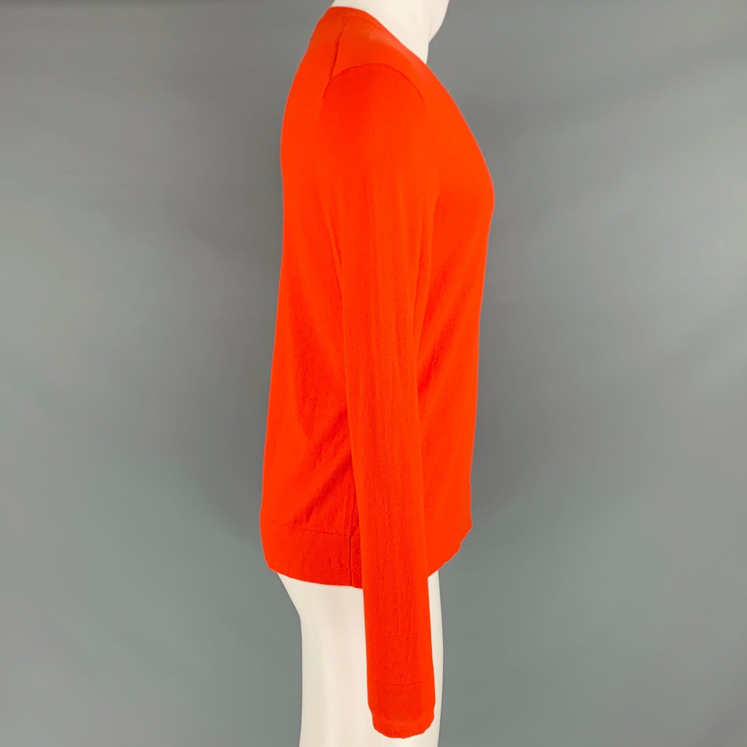 THEORY pullover
in an orange cotton cashmere blend knit featuring a V-neck.Excellent Pre-Owned Condition. 

Marked:   M 

Measurements: 
 
Shoulder: 17.5 inches Chest: 42 inches Sleeve: 26 inches Length: 26 inches 
  
  
 
Reference No.: