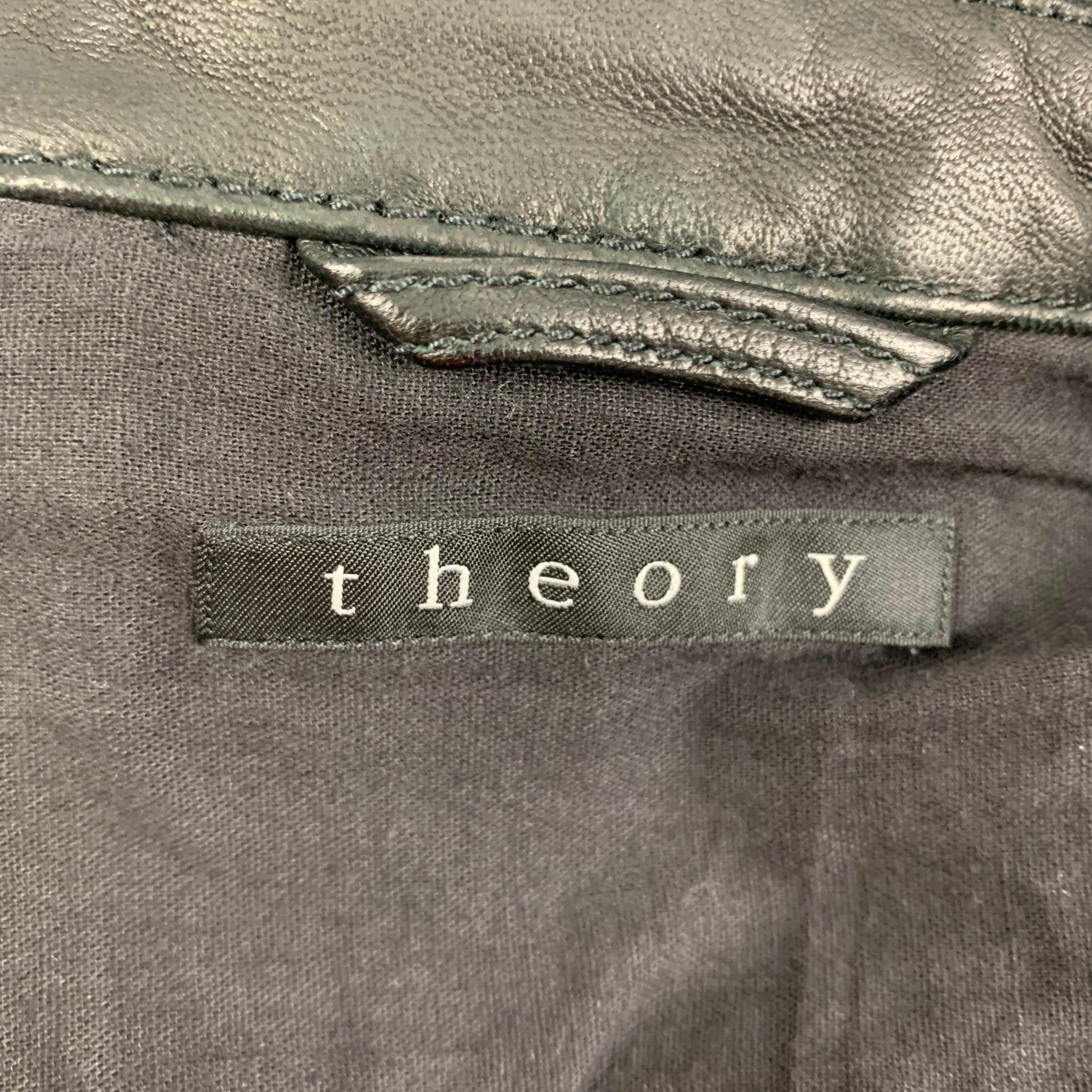 THEORY jacket comes in a black leather featuring a trucker style, top stitching, spread collar, and a buttoned closure. 

Very Good Pre-Owned Condition.
Marked: S

Measurements:

Shoulder: 16.5 in.
Chest: 36 in.
Sleeve: 26 in.
Length: 23.5 in. 