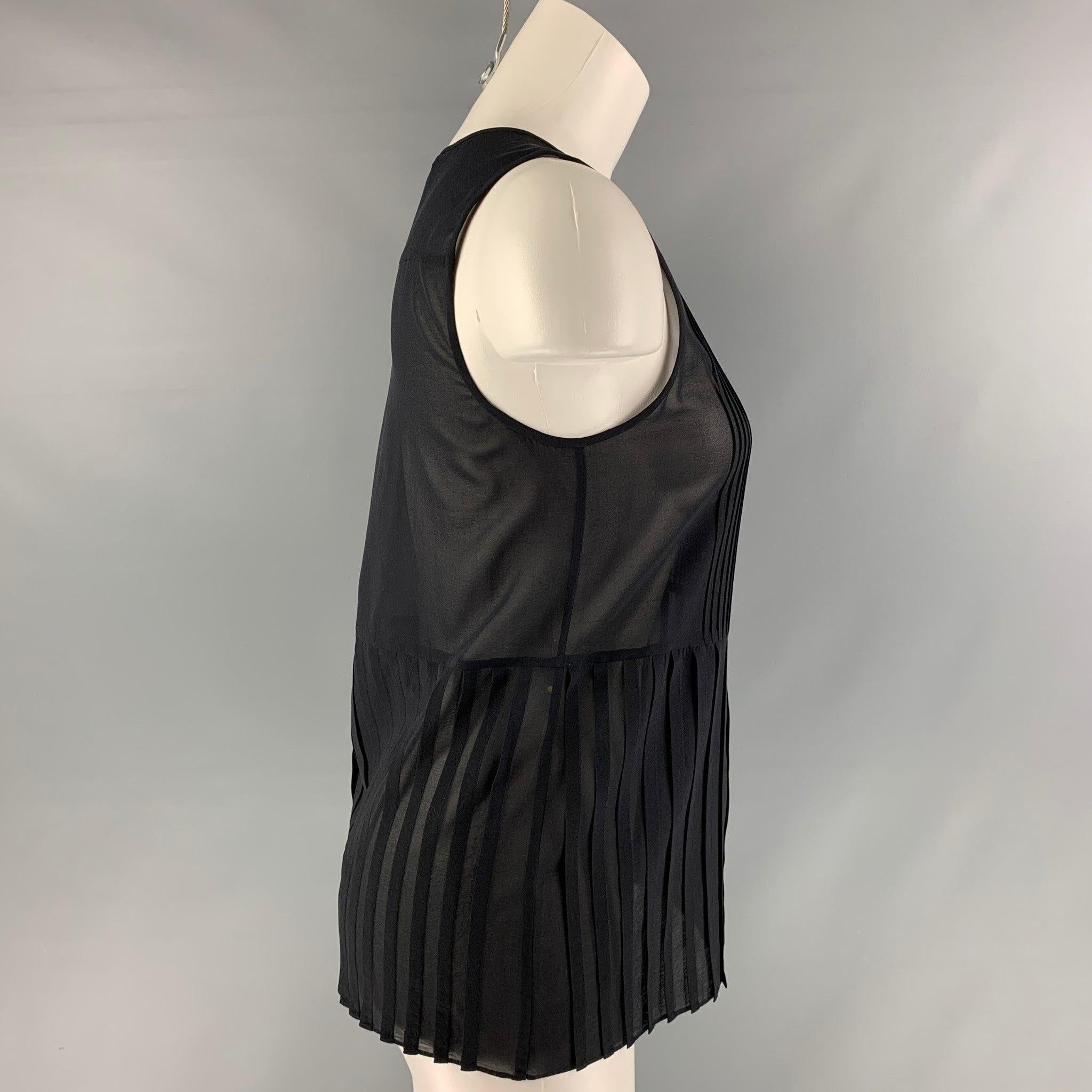 THEORY sleeveless blouse comes in black silk and elastane fabric featuring a sleeveless style, pleated detail at front and button down closure.Excellent Pre-Owned Condition.  

Marked:   S 

Measurements: 
 
Shoulder: 12 inches Bust: 34 inches