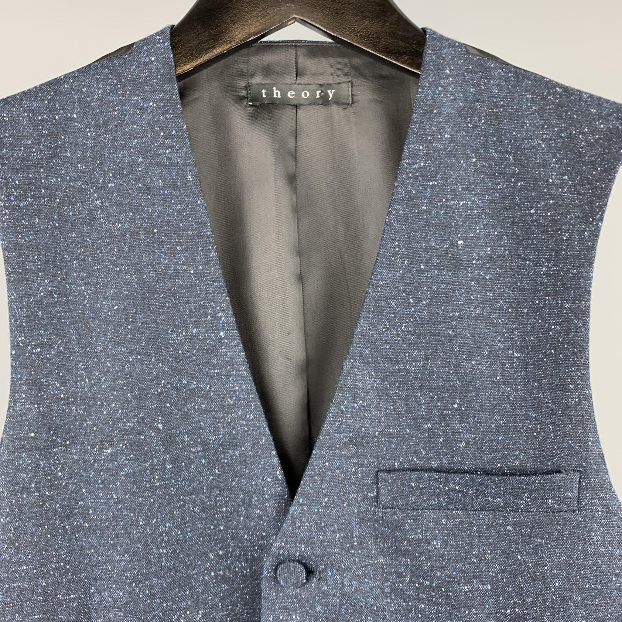 THEORY vest comes in heathered navy silk blend with a V neck. 

Excellent Pre-Owned Condition.
Marked: US 36

Measurements:

Shoulder: 13.5 in.
Chest: 33 in.
Length: 23.5 in.