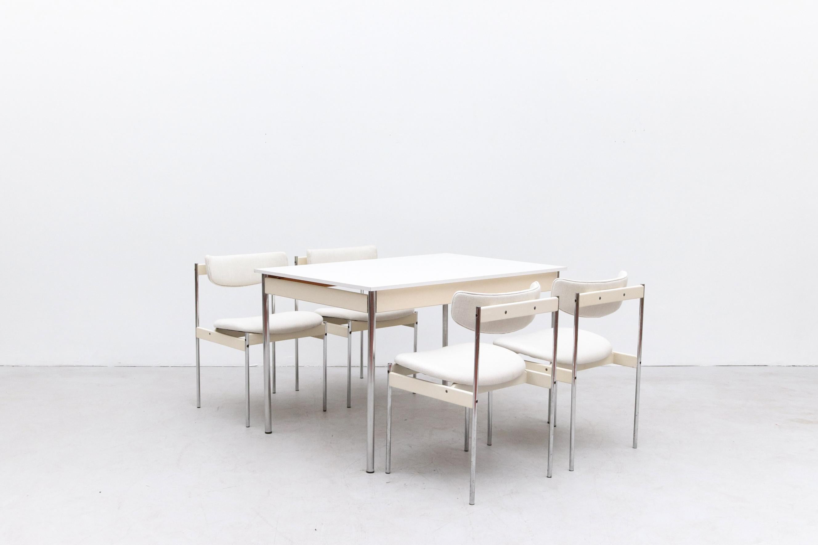 Thereca Dining Set with White Formica and Chrome Table and Matching Newly Upholstered Chairs with White Painted Wood and Chrome Legs. Chairs Measure 20 x 19.75 x 18/30. Table and Chair Frames are in Original Condition with Wear Consistent with its