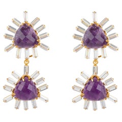 These statement earrings feature faceted triangle-shaped semi-precious stones an