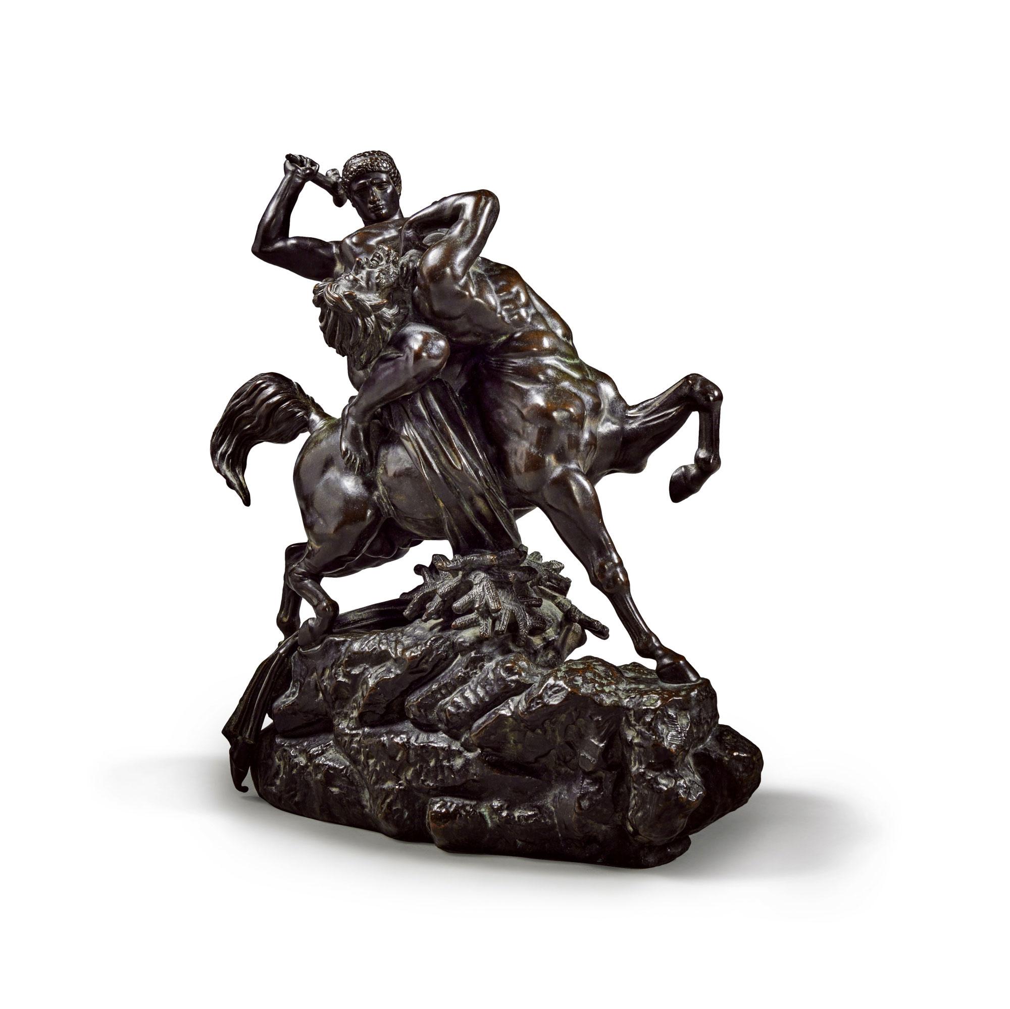 Gorgeously dynamic sculpture of Theseus and the Centaur depicted in mid battle. Thesus has mounted the centaur whom he attempts to strike with a large stick. Thesus twists the Centaur's neck to face him as the mythical being's long hair and beard