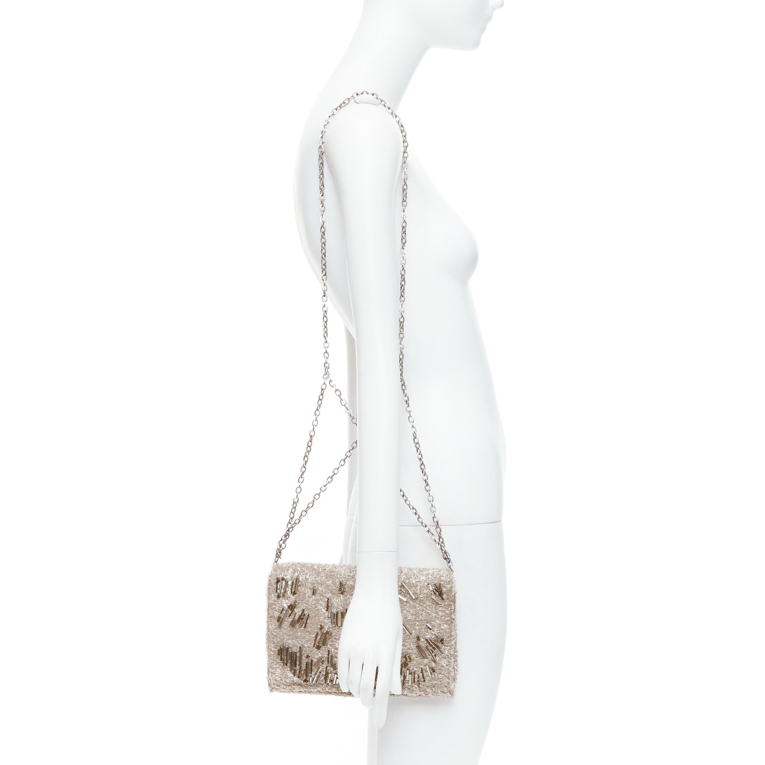 THEYSKENS THEORY grey silver embellished lurex appique fold clutch
Reference: NKLL/A00306
Brand: THEYSKENS THEORY
Material: Fabric
Color: Grey
Pattern: Solid
Closure: Magnet
Lining: Grey Leather
Extra Details: Crisscross chain