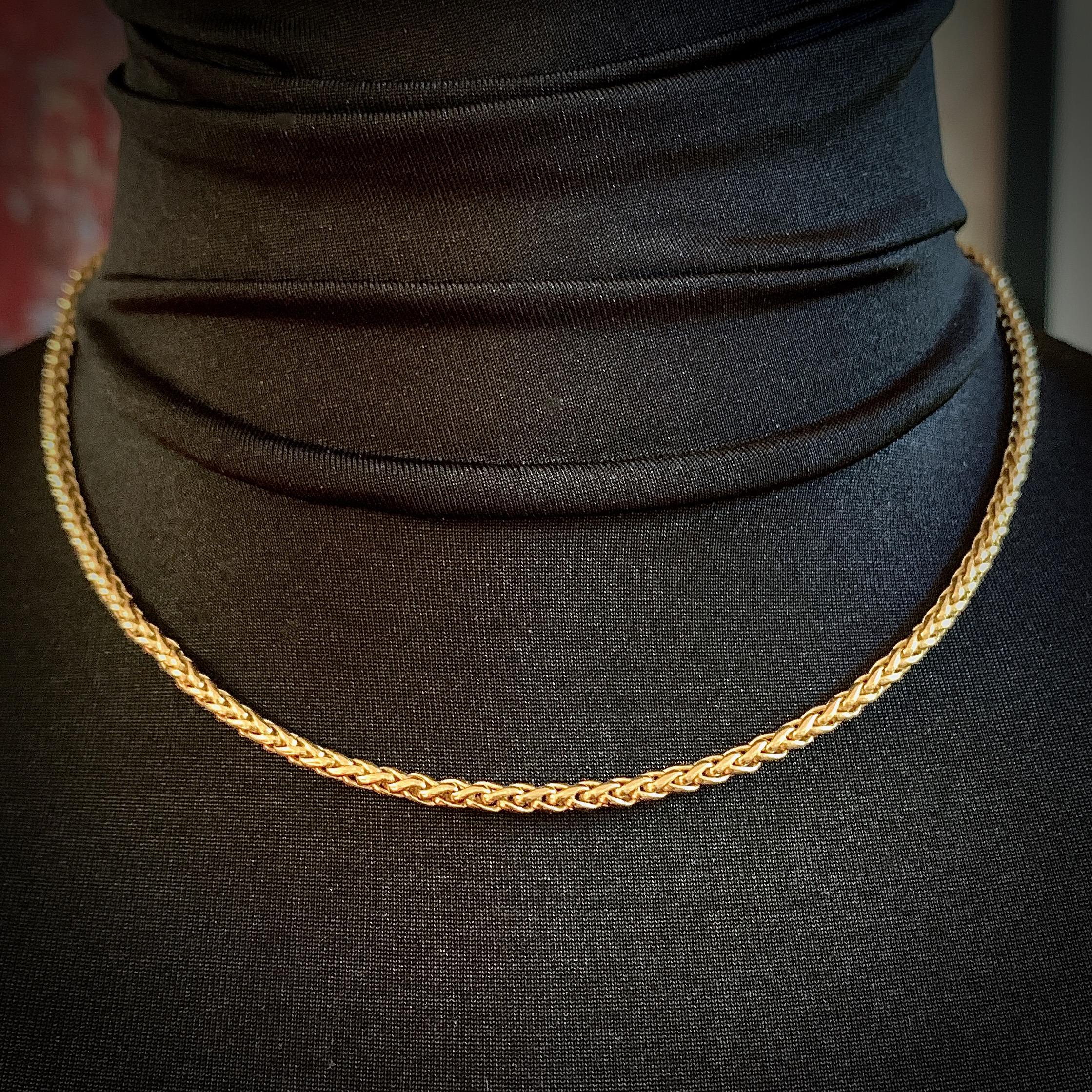 This versatile, luxuriously thick and substantial wheat (aka palma) chain stands out in rich, vivid 18K gold.  A great neckline enhancer when worn alone, it's also a good length for pendants and layering;   the oversized lobster clasp even works as