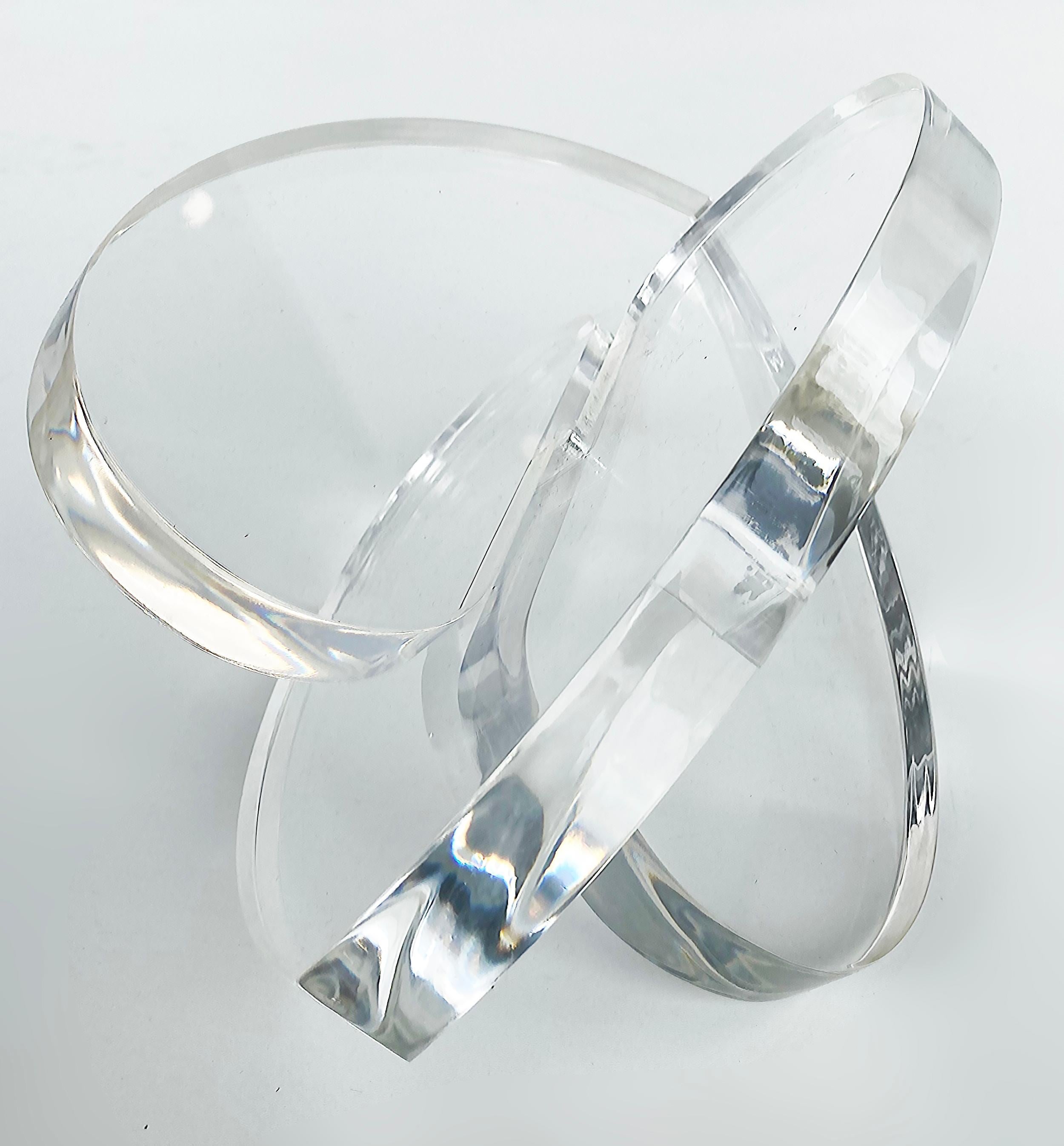 Thick Clear Lucite Interlocking Hearts Sculpture by Miami Artist Michael Gitter

Offered for sale is a thick clear lucite interlocking hearts sculpture by Miami based artist Michael Gitter.  These hearts are made in many different colors and are