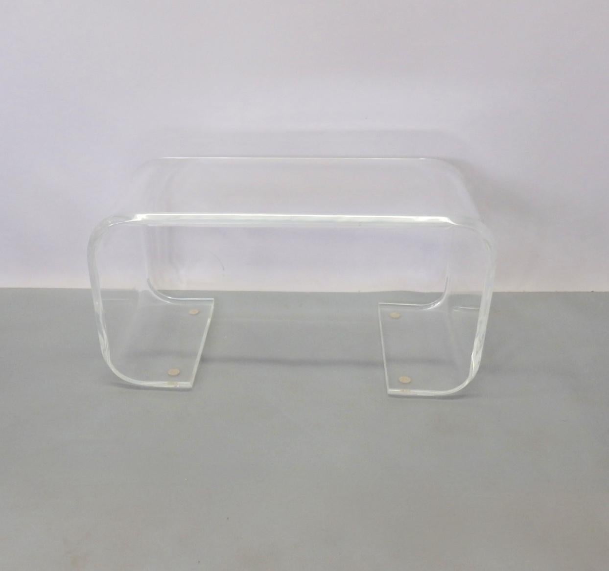 Thick Lucite acrylic coffee, cocktail table. Easily used as a bench with or without your custom cushion.
