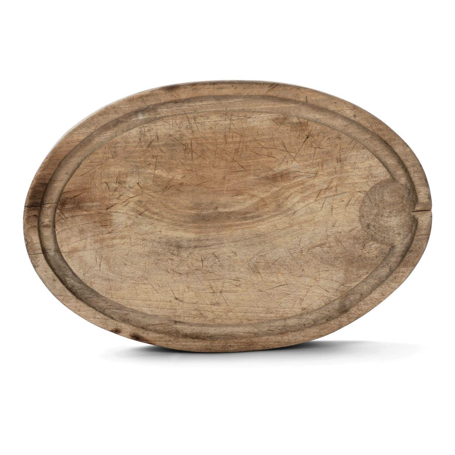 Thick oval-shaped cutting board, hand-carved in French oak. Extremely decorative and features a channeled groove designed to catch juices and drippings when cutting meats.

Note: Regional differences in humidity and climate during shipping may cause