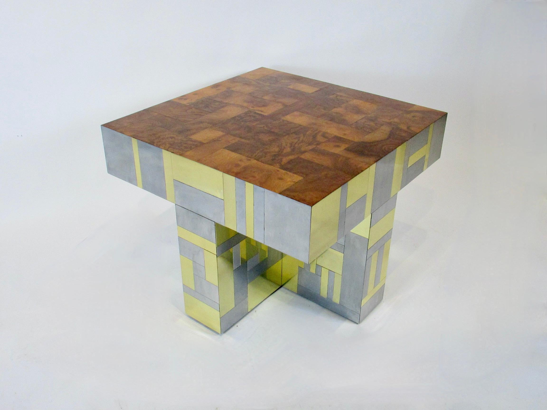 Paul Evans designed side or lamp table. Designed for the Directional  City Scape series. Tabletop is a patchwork of Burl wood. Cruciform base is a patchwork of brushed stainless steel and polished brass. Signed Paul Evans. There are typical scuffs