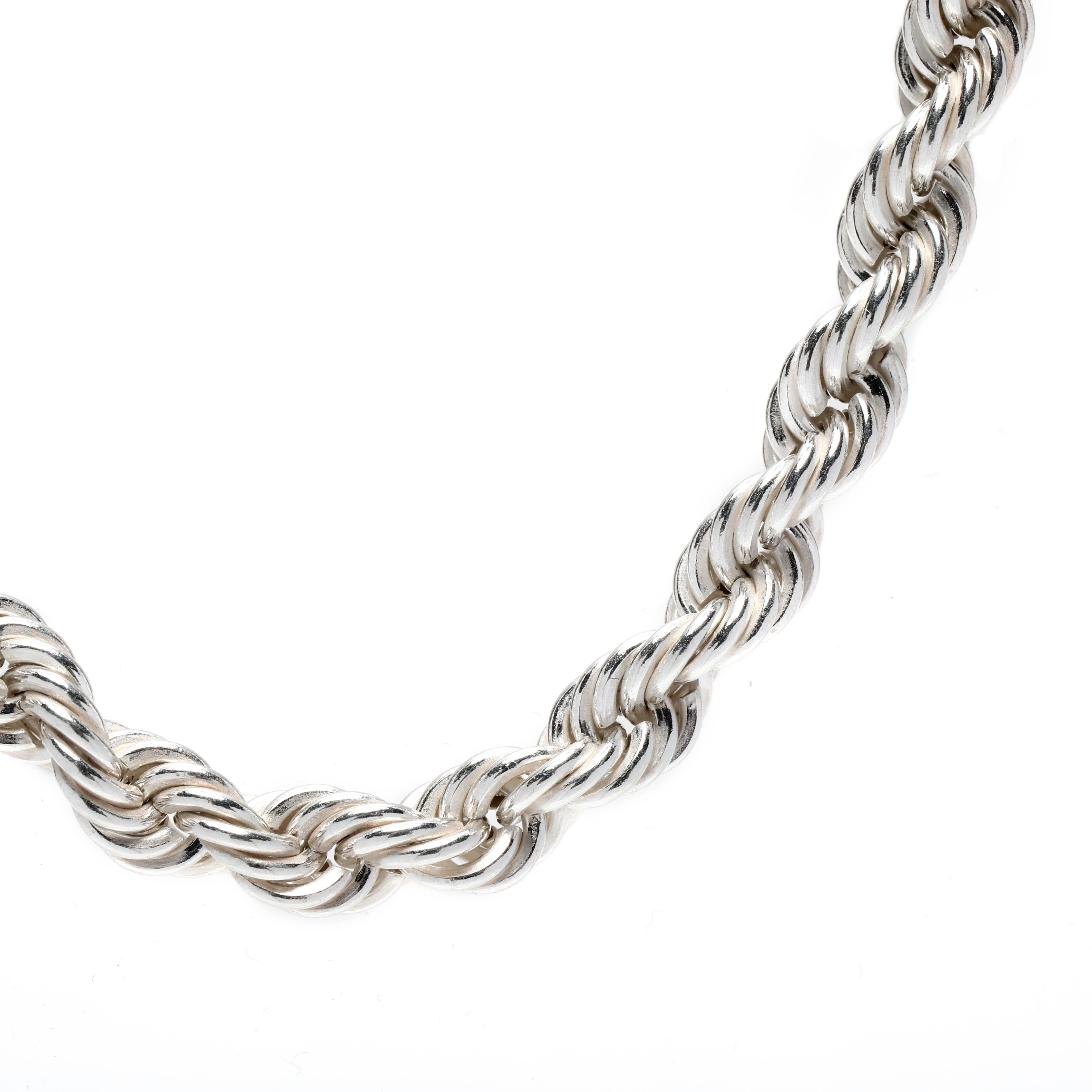 This stunning Rhodium Plated Sterling Silver Thick Rope Chain Necklace is the perfect accessory for any outfit. The length of the chain is 18 inches and it features a hollow rope chain with wide link rope chain style. The Rhodium plating gives it a