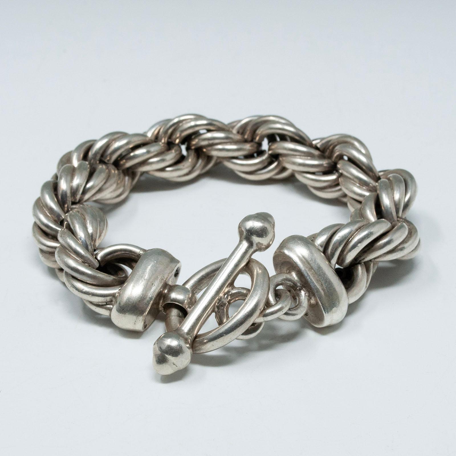 Thick Silver Twisted Rope Bracelet, Taxco .950

A dramatic thick hand-made twisted rope .950 silver bracelet from Taxco, Mexico, with a toggle clasp. It measures 9.5 inches long and .75 inches wide, with a weight of 129 grams.

Free shipping within