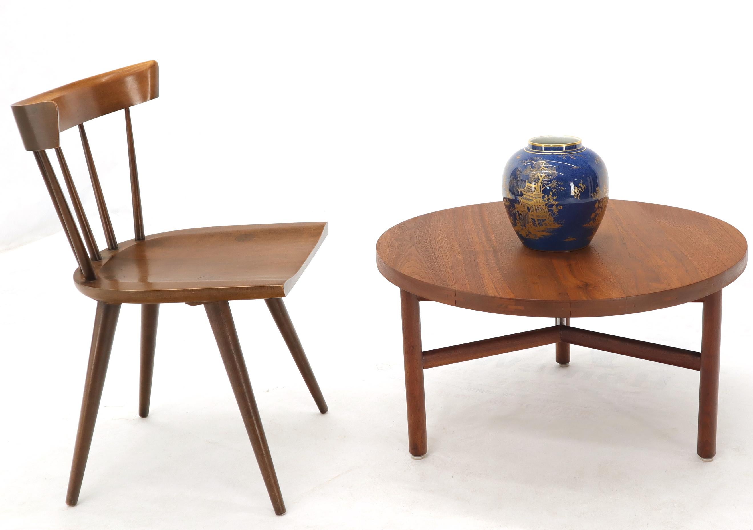 High quality Danish mid century modern round thick solid teak coffee table on tri legged base.