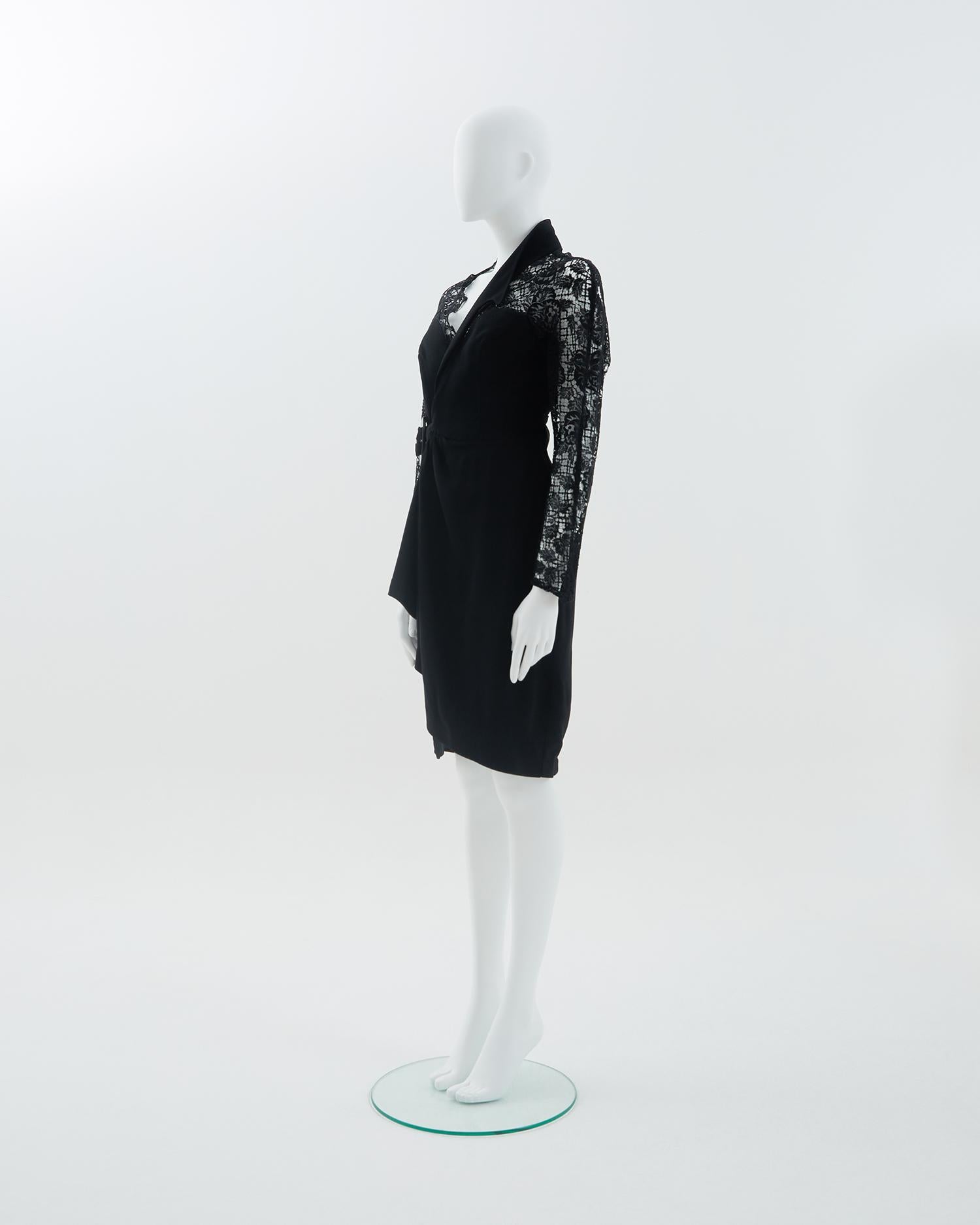 - Black rayon blend crepe asymmetrically draped cocktail dress
- Sold by Skof.Archive
- Asymmetrically draped 
- Plastic iconic buckle closure 
- Sheer lace back and sleeves 
- Fitted to the body 
- 1980s period

Size
FR 40 - EN 44 - UK 12 - US 8