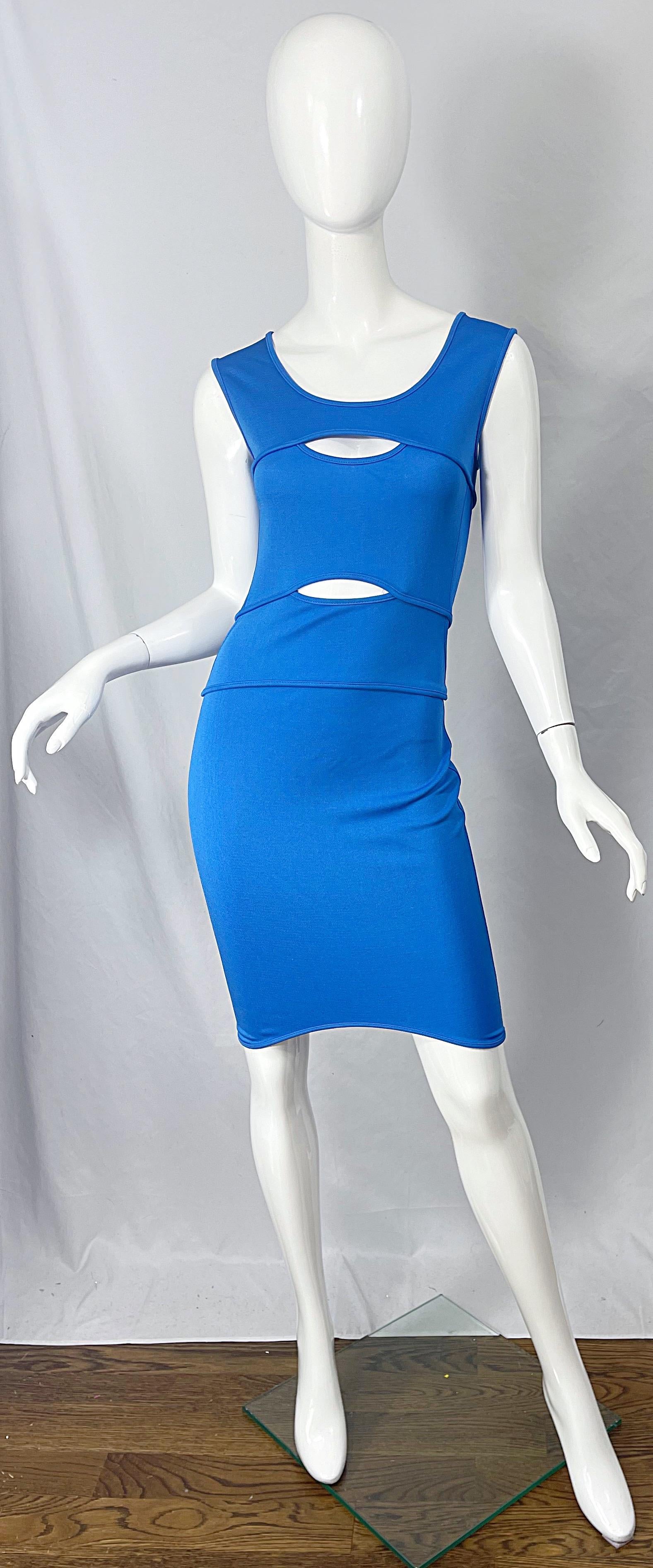 Sexy late 80s THIERRY MUGLER blue cut-out bod con dress ! Features a form fitting stretch rayon fabric with cut-out above the bust and under. Hidden zipper up the back with hook-and-eye closure. The perfect alternative to a little black dress. This