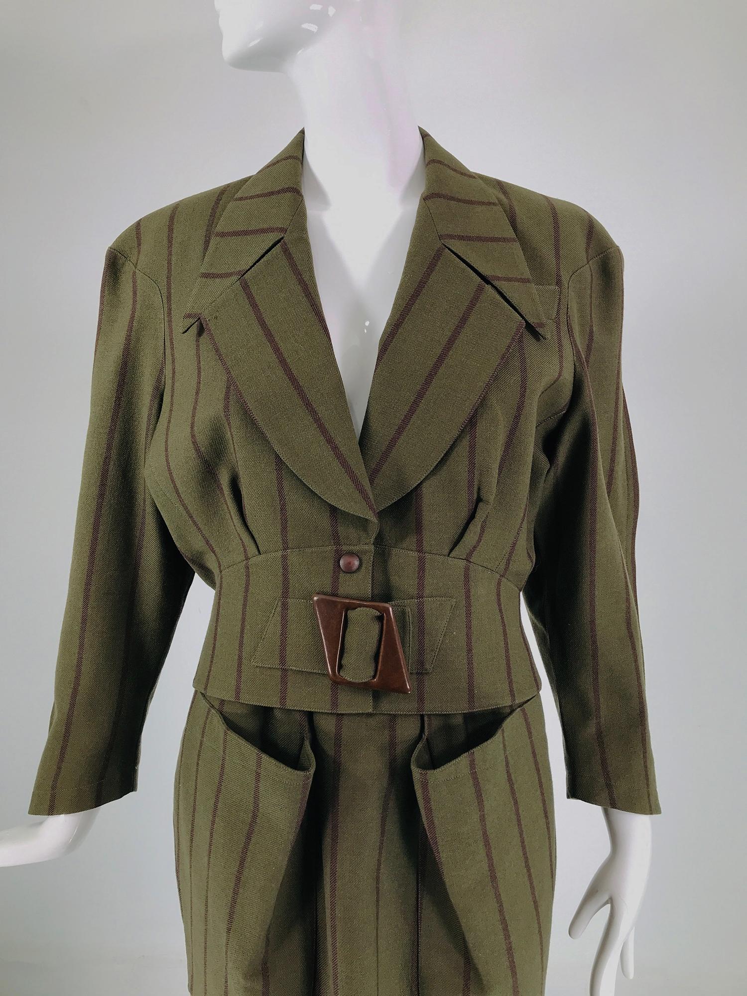 Thierry Mugler 1980s Green & brown stripe nip waist, big shoulder jacket and high waist snap back pencil skirt. The jacket has wide shoulders, the sleeves are set in with curved seams. Exaggerated shoulders taper to a wide high fitted waist, the
