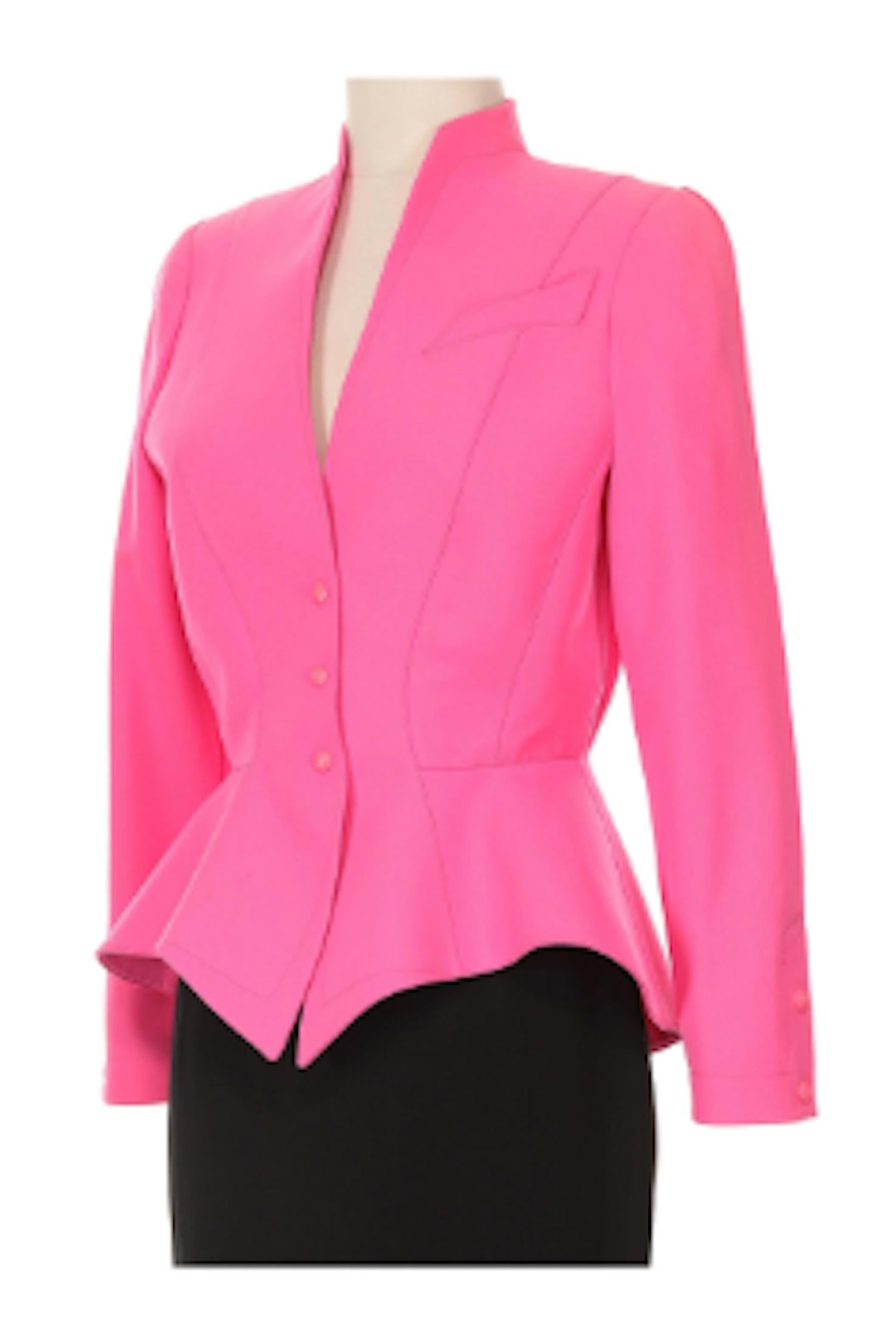  Thierry Mugler Hot Pink Jacket and Black Mini Skirt Circa 1980's.Vibrant pink jacket with signature pointed details and back mini skirt with hidden zipper closure.

- Monochromatic snap buttons 
- 100% wool and 100% polyester lined
- Size FR 36
-
