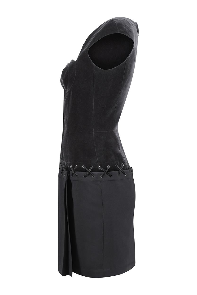 This incredible 1990s black velvet cocktail dress is by Thierry Mugler, a designer renowned for unique style and the structure of his designs. This piece is a superb example of the urban edginess and sophistication synonymous with his work and is in