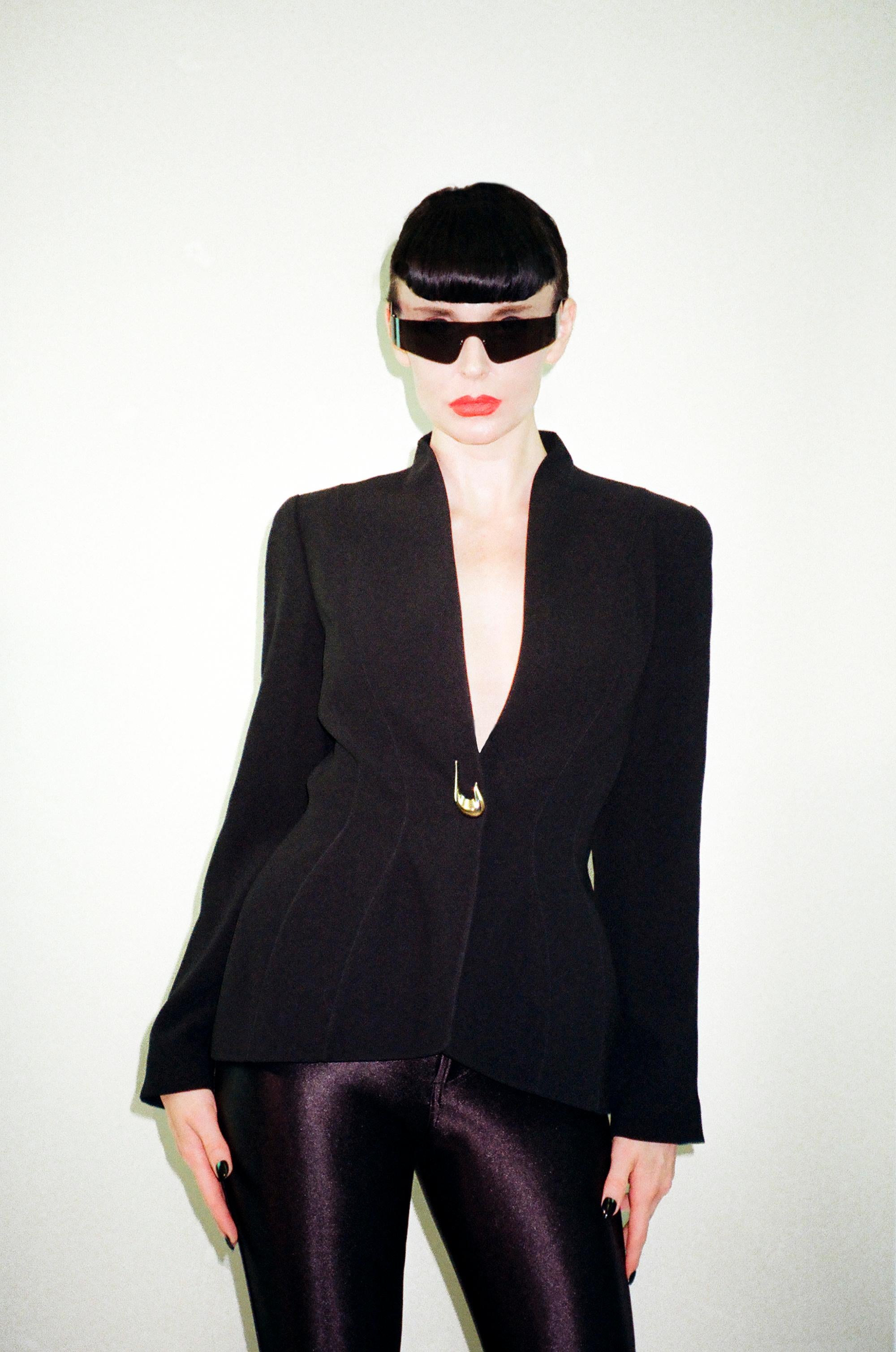 Amazing vintage Thierry Mugler black blazer from collaboration with 3 Suisses le Chouchou from the year 2000.

The 3 Suisses was a mail order company who collaborated with many iconic designers from the 1970s onwards including Thierry Mugler, Jean