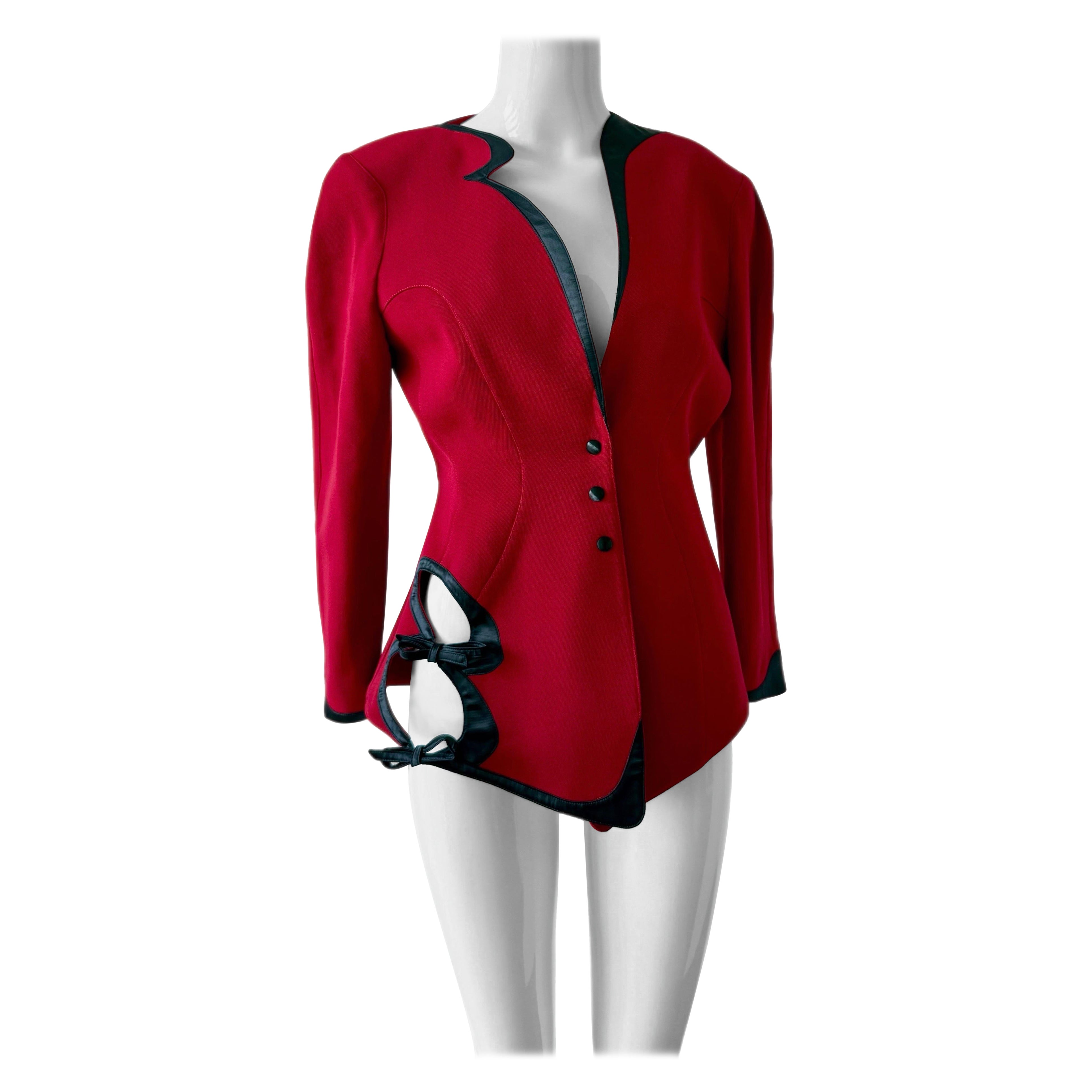 Thierry Mugler
1980's to 1990's
Vintage
2 piece skirt suit set
(Hat sold separately)
Brick red with jet black satin trim
Cut-out at side
Unique neckline
Signature exaggerated cinched waist
Matching pencil skirt
Size and comp tag missing but fits