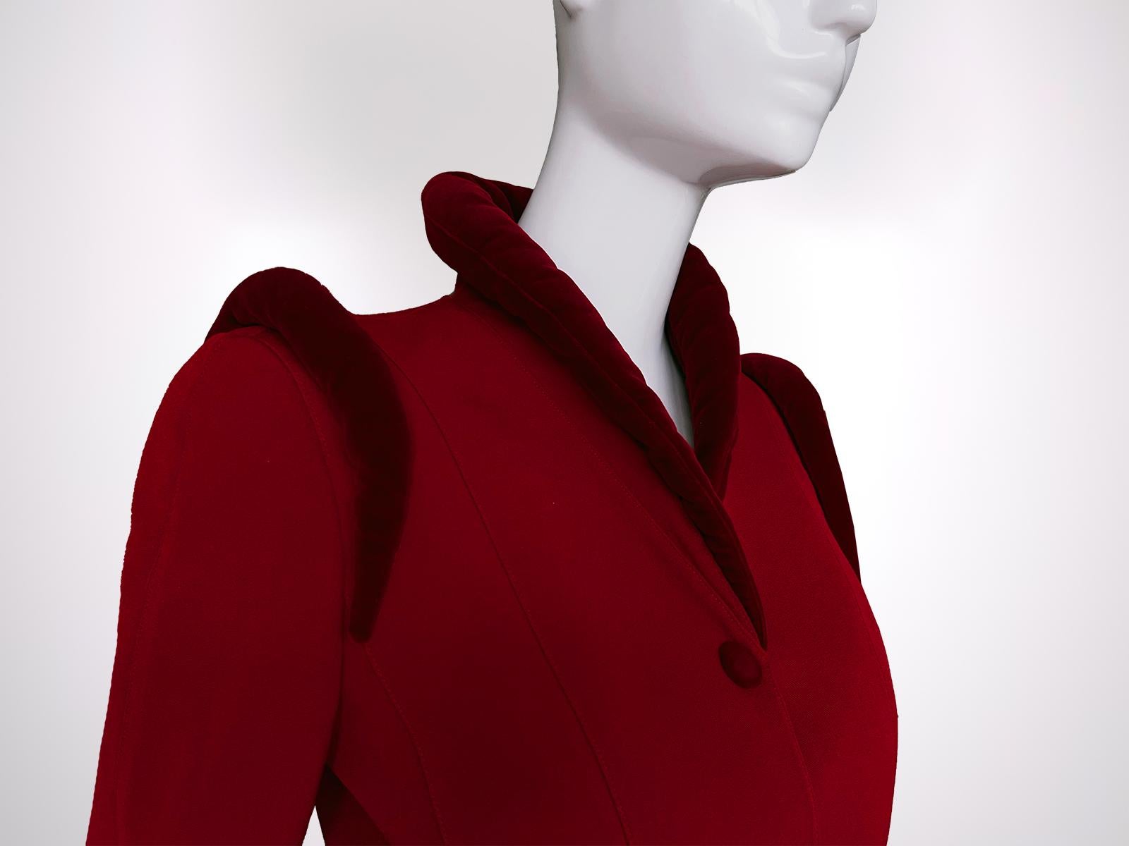 Gorgeous rare Thierry Mugler jacket, assuming FW 1997 Collection.
It features strong, structured shoulders with dramatic rounded velvet padding that is reminiscent of his love for exaggerated and powerful silhouettes. High, stand-up collar, which