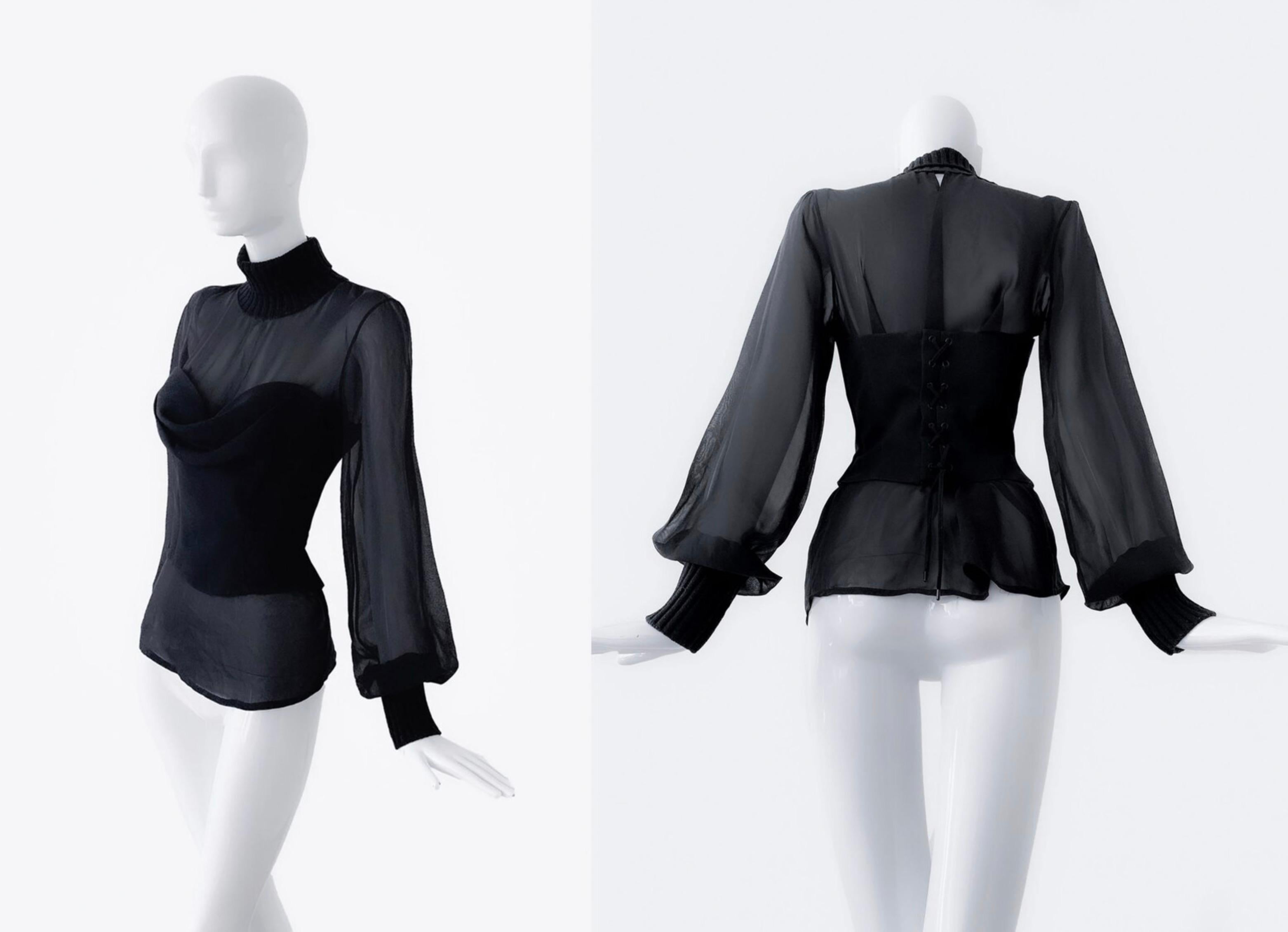 Elegant black Thierry Mugler corset top, assuming 1996 collection.
Beautiful creation with extraordinaiy tailoring. Fitted shape with cascading neckline, really beautiful fit. It closes with metal hooks on the back and has lovely lacing details on