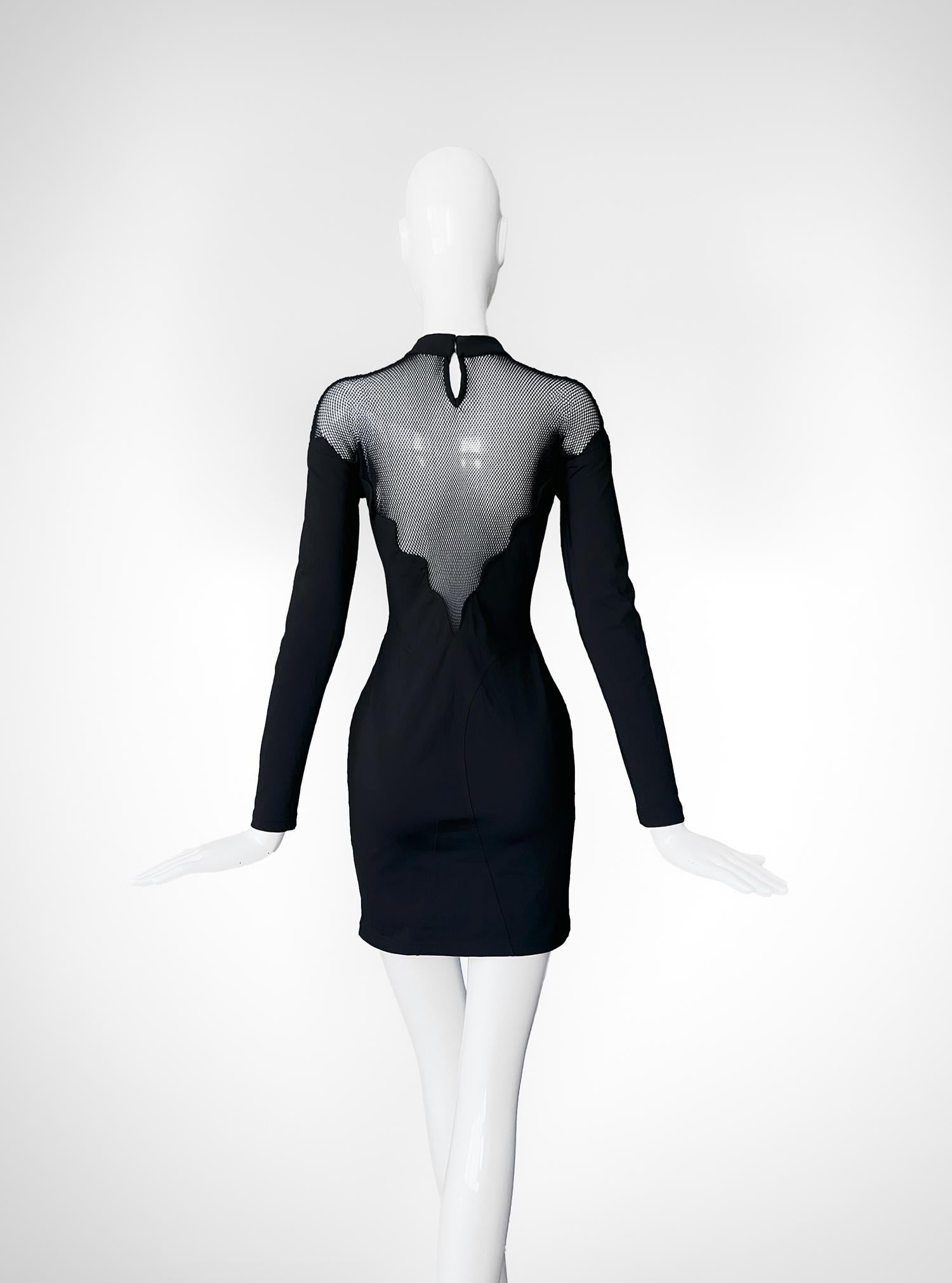 This 1992 Thierry Mugler dress is a striking fusion of elegance and bold futurism, embodying the designer's signature avant-garde style. The dress, rendered in a sleek black fabric, is form-fitting, hugging the body in a way that accentuates the