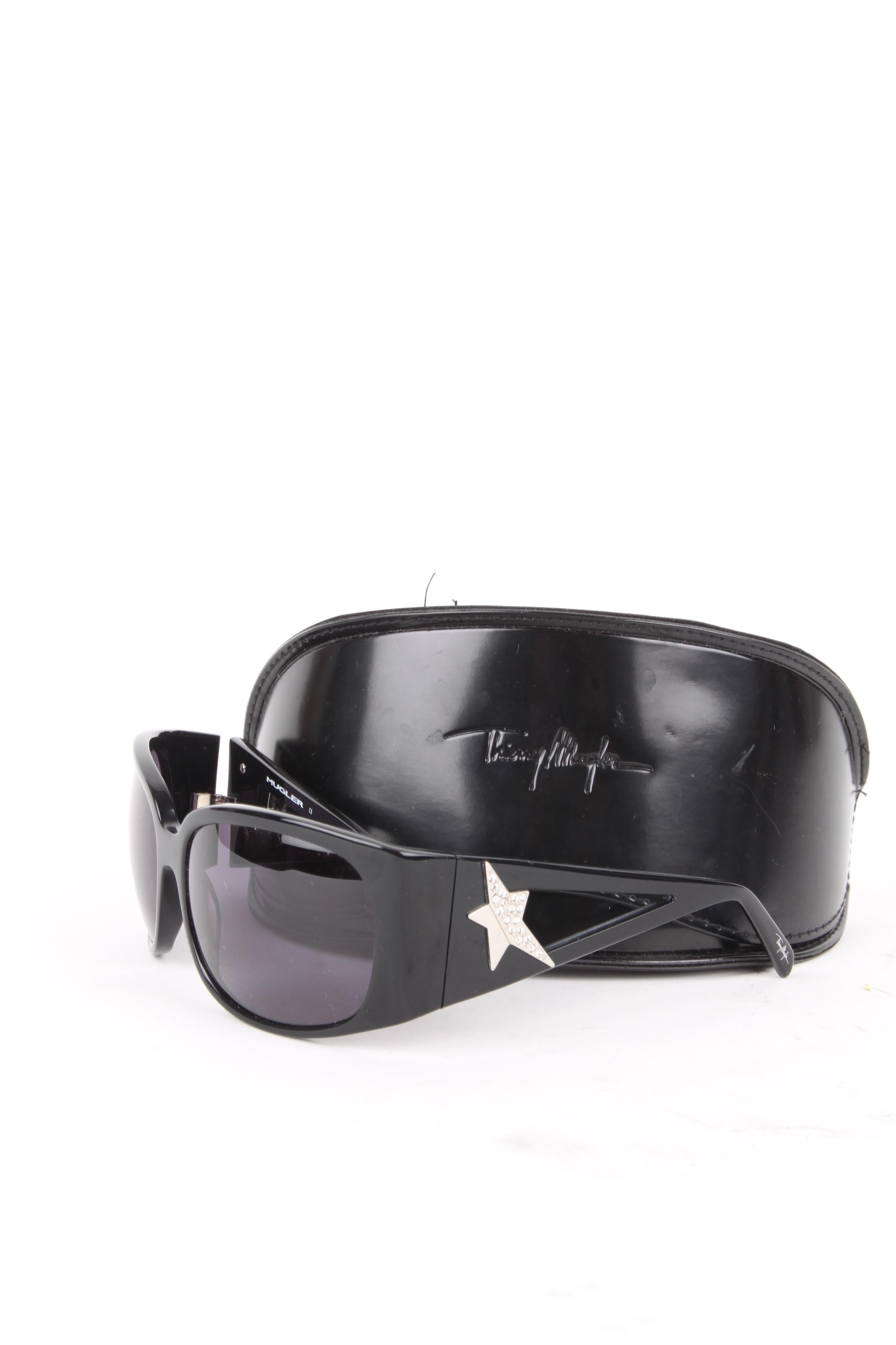 Thierry Mugler Black Lucite Star Swarovski Rhinestone Embellished Sunglasses.

These Thierry Mugler sunglasses have a retro but chic appeal. They feature a swarovski rhinestone embellished detail on the frames and an openweork frame design and