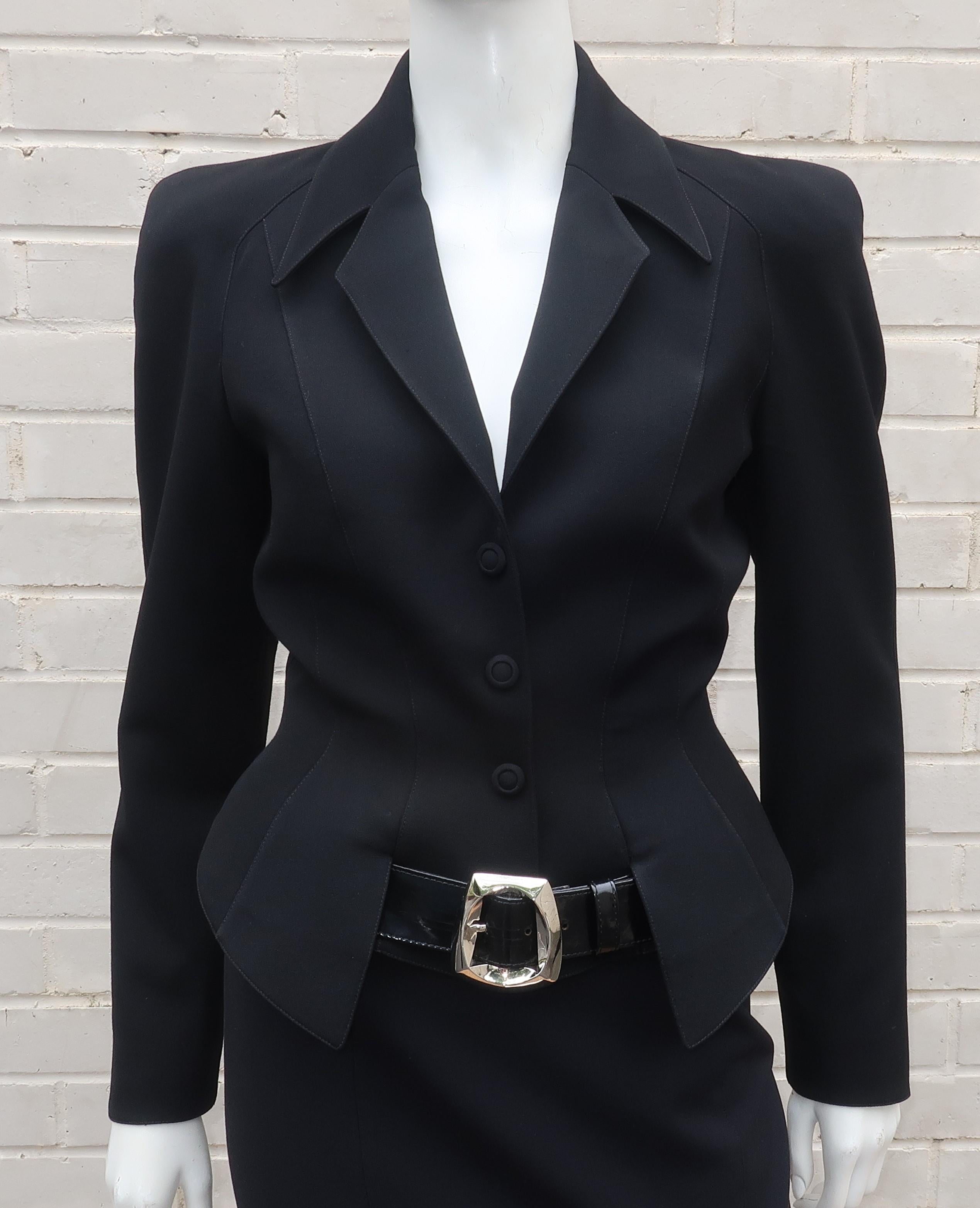 If Emma Peel owned a Thierry Mugler suit ... this would be it!  This two piece skirt suit is a body conscious design with nips, buckles and zippers in all the right places.  The jacket is a classic Mugler look with faux buttons, snap closures,