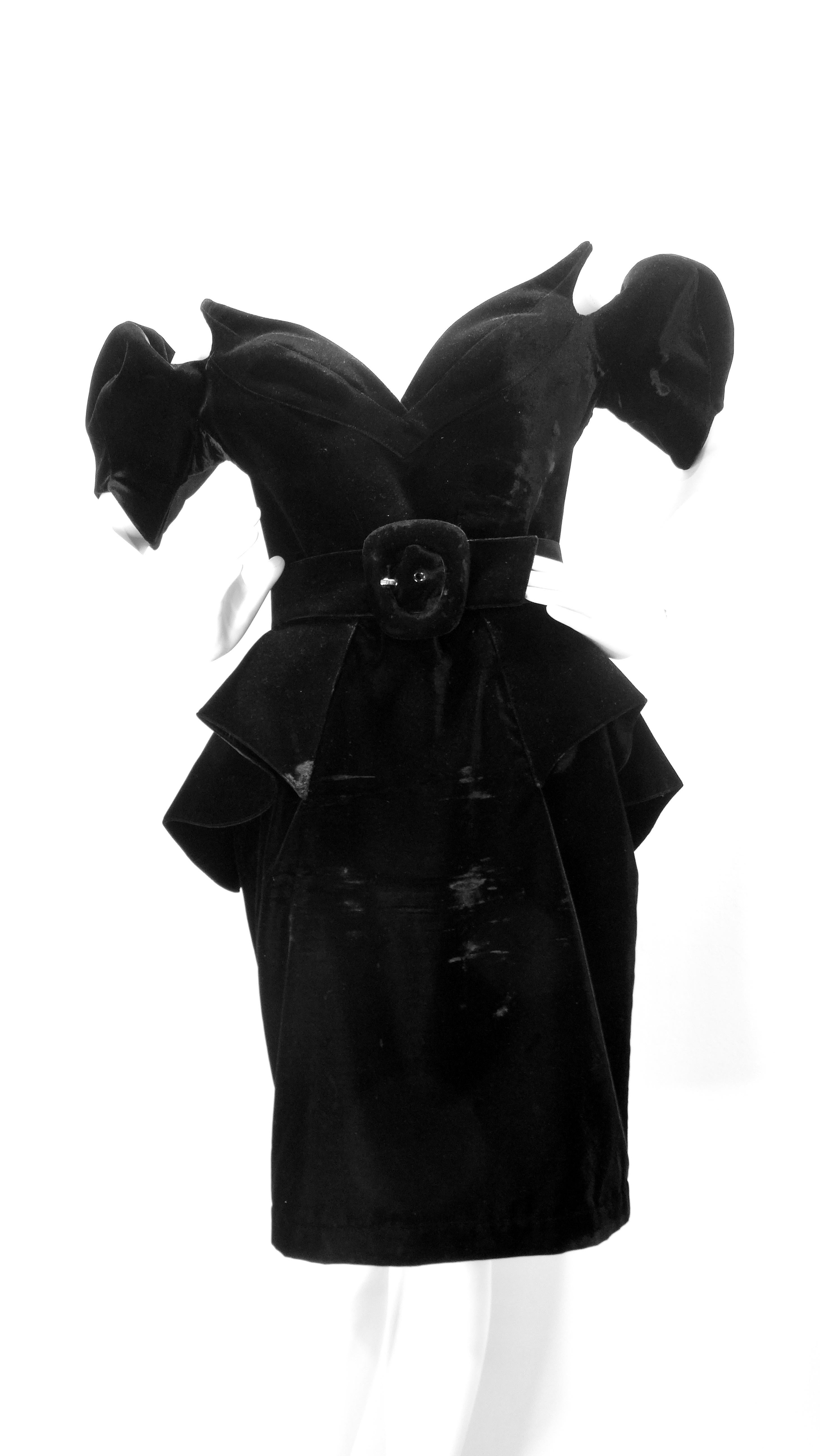 This is a historic dress by none other than the iconic Thierry Mugler! This is a Haute Couture black velvet dress known as the 