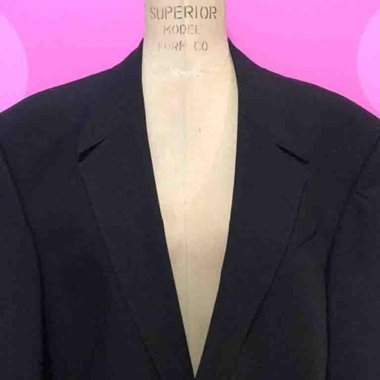 The classic Black wool gabardine blazer by Thierry Mugler is a very wearable vintage find. Unique metal star buttons. Classic Shape.

Size 52
100% Wool - High Twist
Made in France
Ask for measurements to ensure fit
